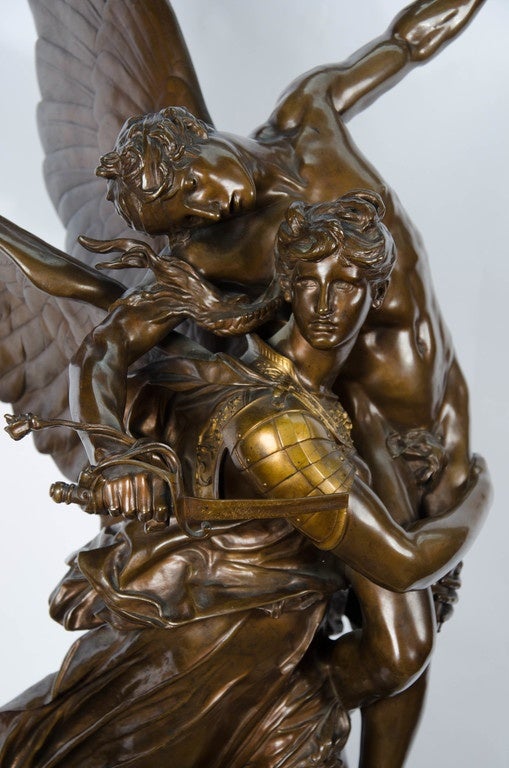A Sculpture of Gloria Carrying the Angel Victis, Cast by Barbedienne and After a Model by Marius-Jean-Antonin Mercié (French, 1845-1916). The draped figure of Gloria carrying the angel Victis, on a naturalistic base.