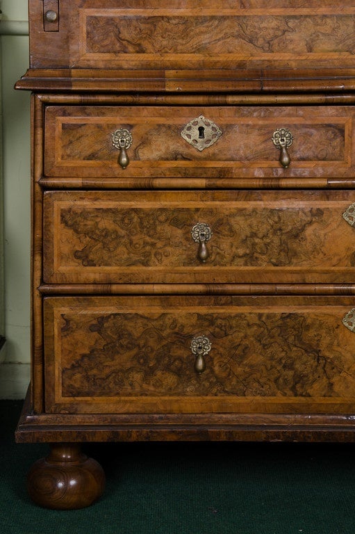 A very good quality 18th century walnut double dome bureau bookcase. The mirror doors open to reveal adjustable shelves, pigeon holes and drawers. The fall front opens to reveal the same layout as above and a well beneath the inset leather writing
