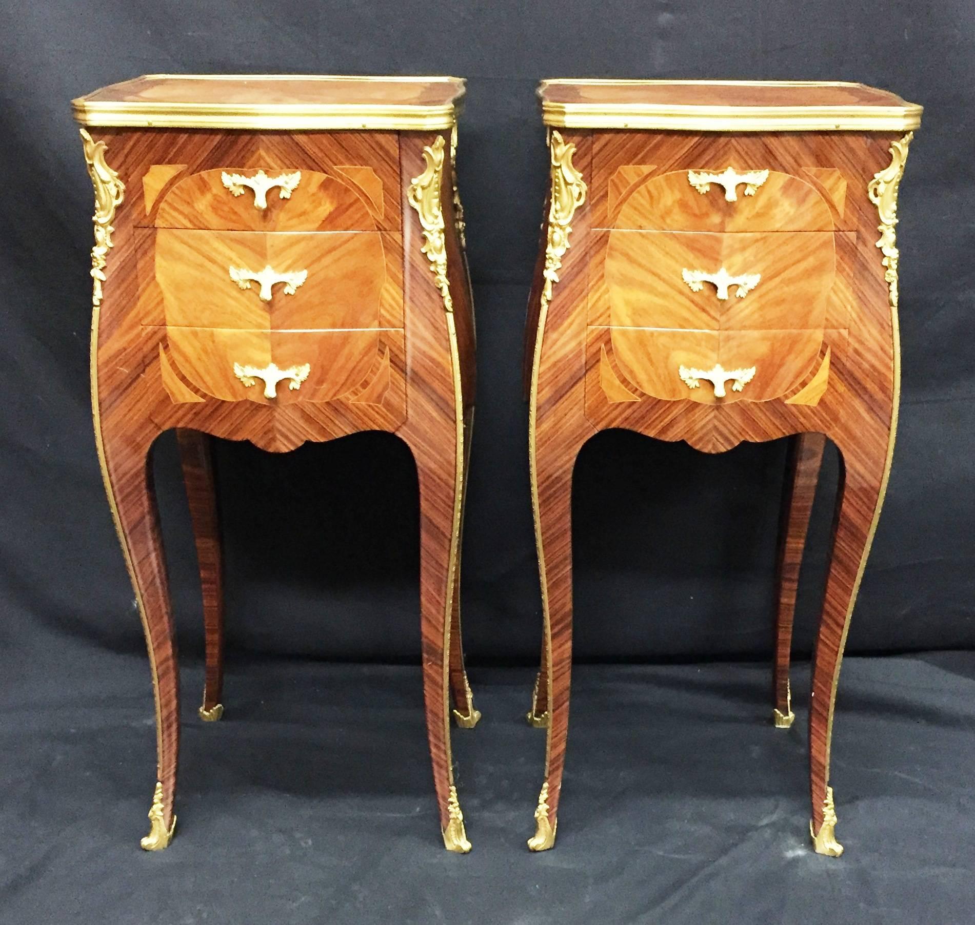 A good quality pair of French kingwood, Louis XV style side tables with ormolu mounts, three drawers to each and raised on cabriole legs.