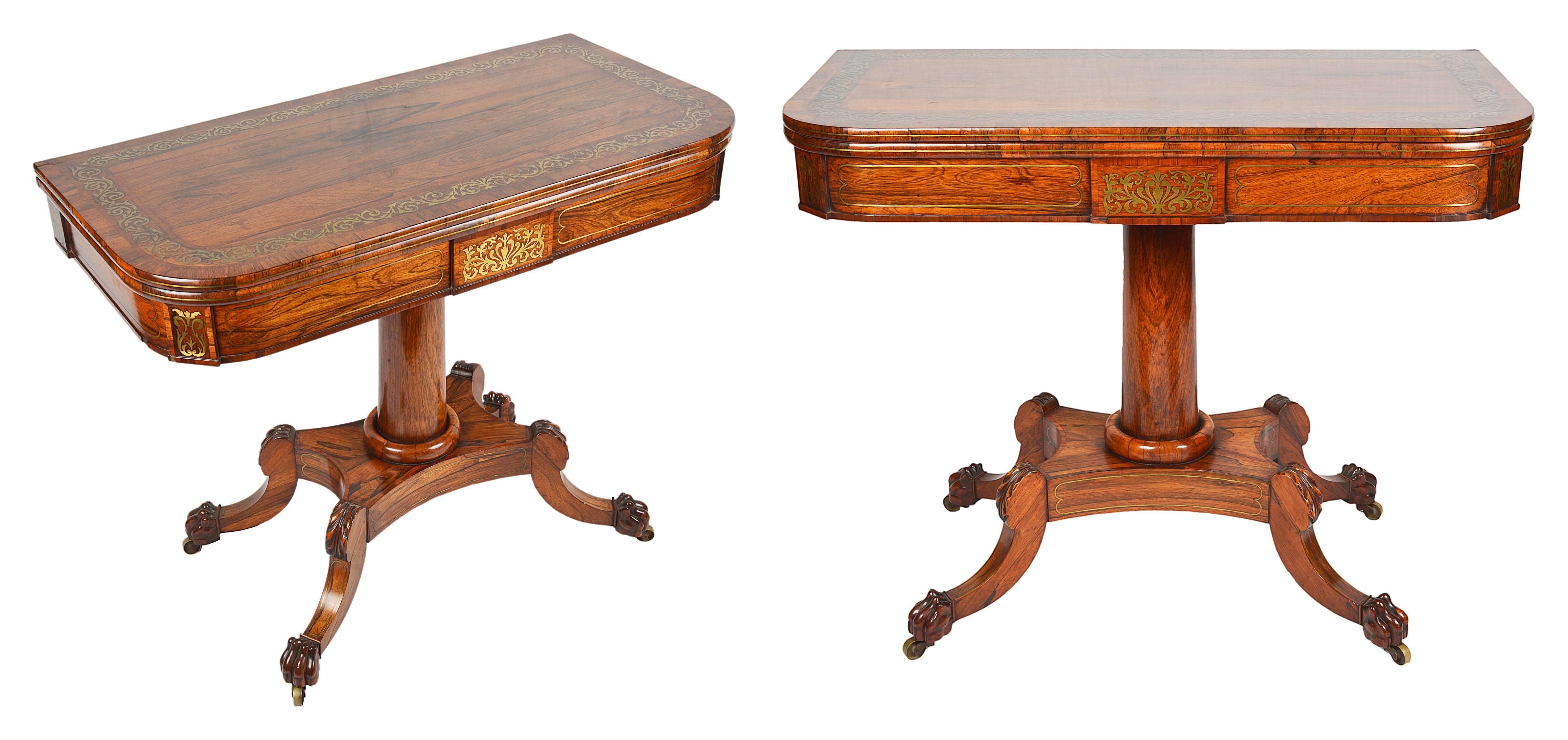 A very good quality pair of Regency period brass inlaid card and tea tables. The tops with scrolling foliate brass inlaid decoration to the crossbanding and frieze. Raised on a turned tapering column, platform base and four splay supports,