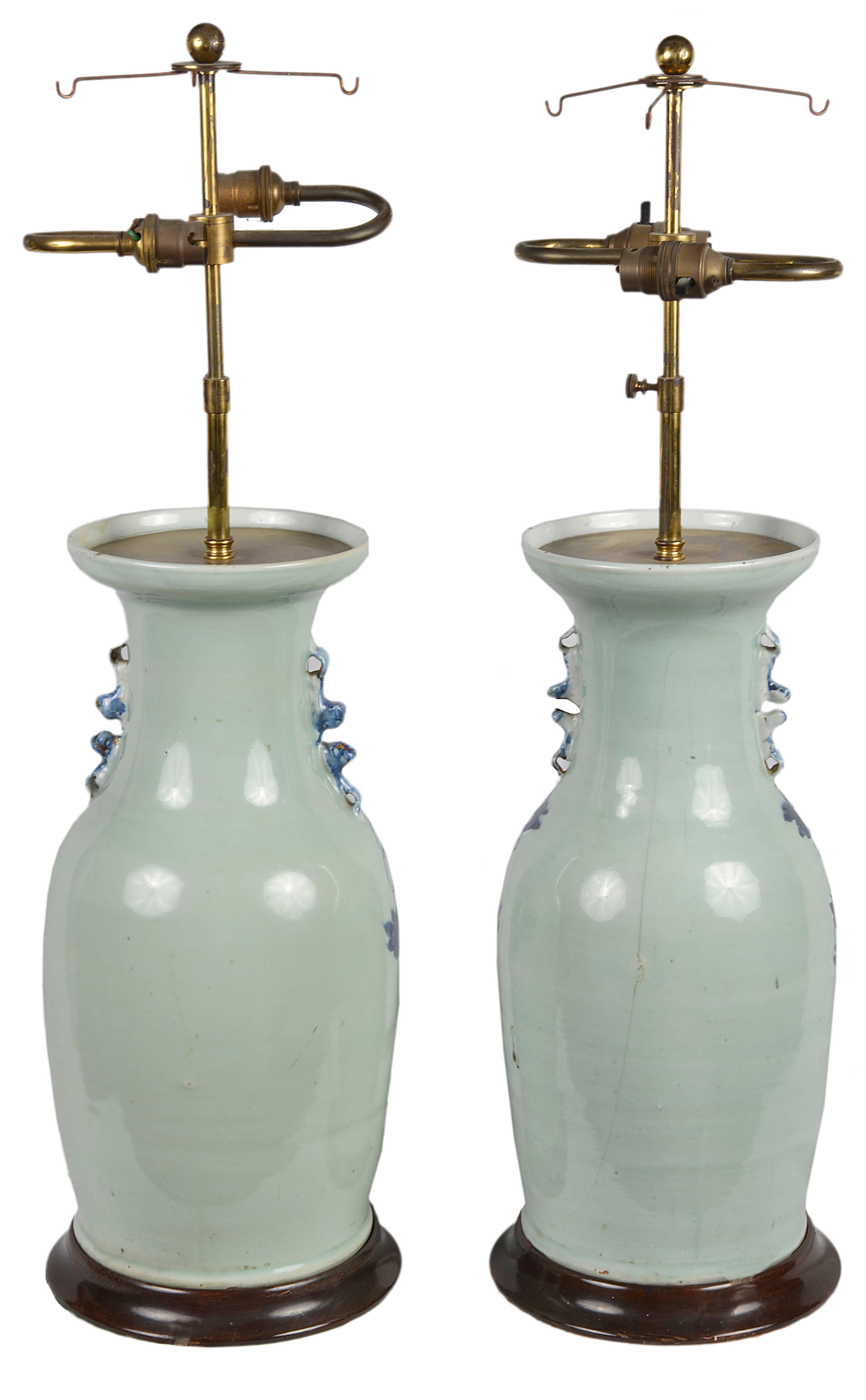 A good quality pair of late 19th century Chinese blue and White vases, depicting flowers, exotic birds and foliage, set on ebonised bases and converted to lamps.