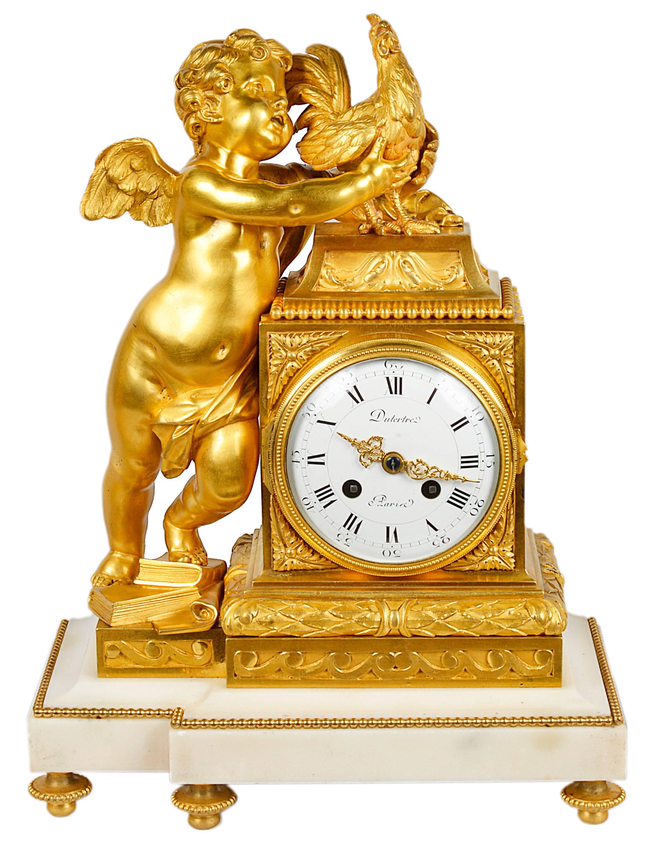 A very pleasing French gilded ormolu and white marble clock garniture in the Louis XVI style. The clock having a cherub holding a chicken, the white enamel clock face with an eight day striking movement, signed; Dutertre, Paris
The pair of four