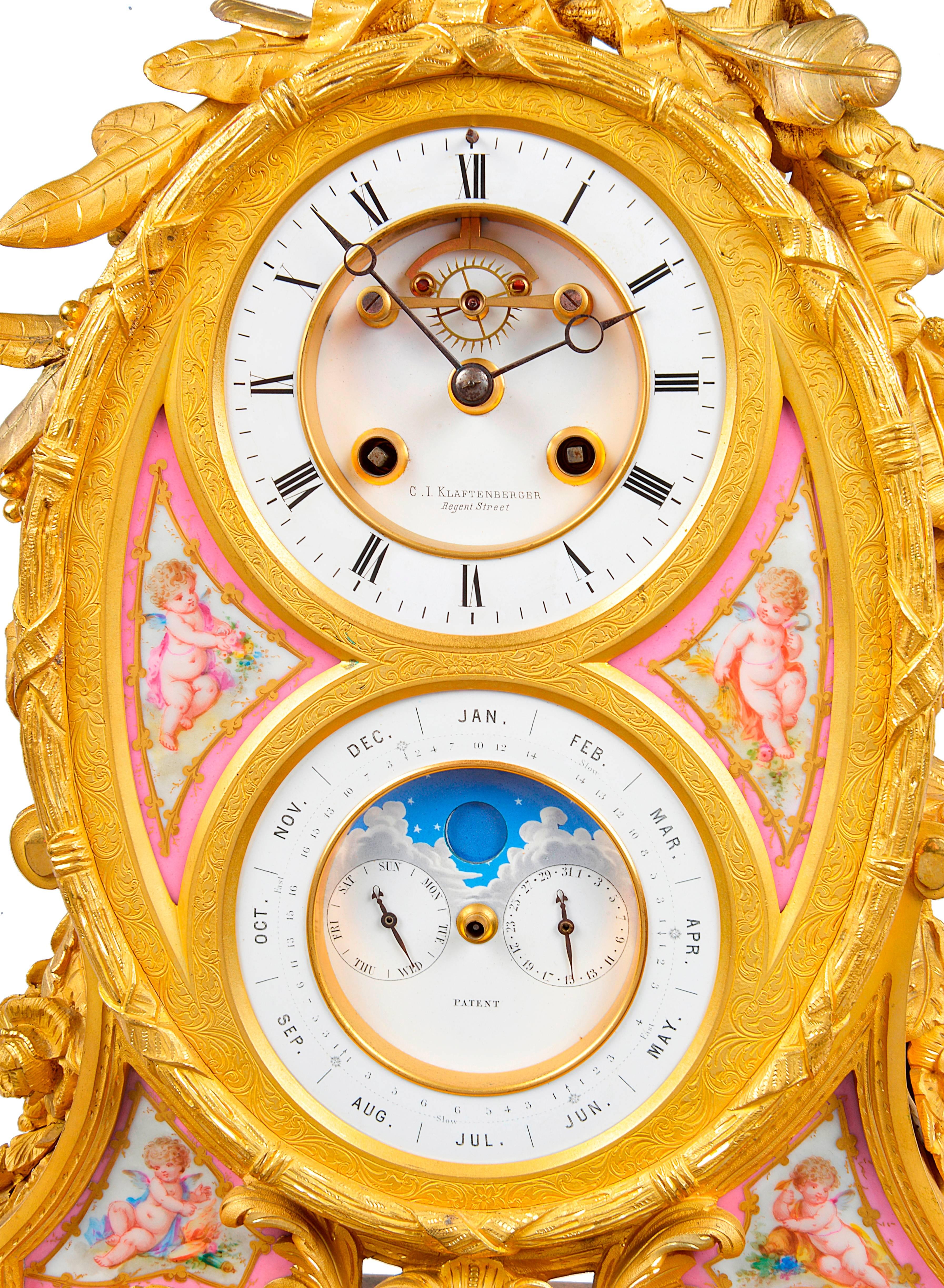 A very good quality French, 19th century gilded ormolu mantel clock with a calendar dial. Having pink Sevres porcelain panels. Foliate and ribbon decoration, the clock being an eight day movement and striking on the hour and half hour. 
Make;