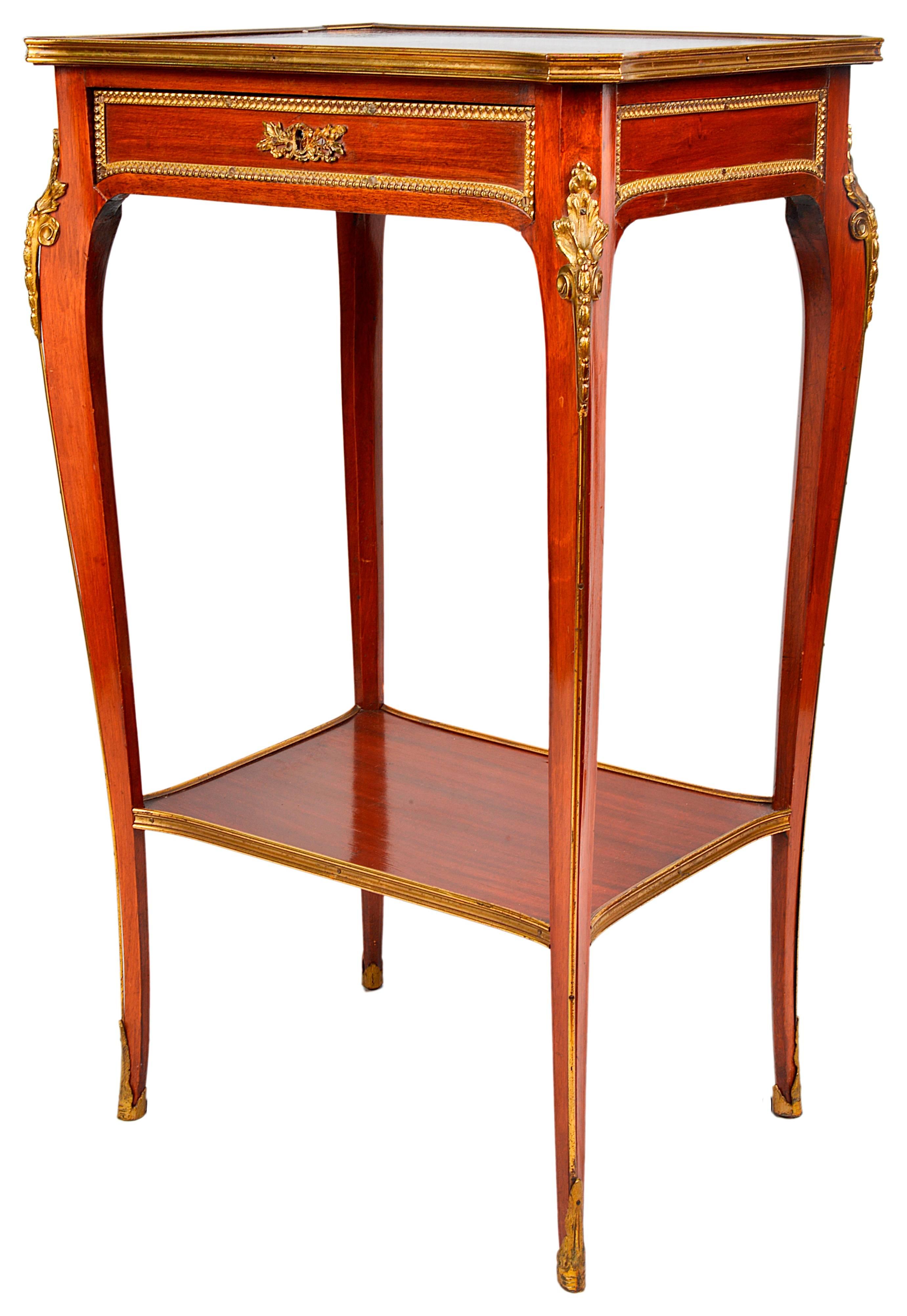 A good quality pair of French freestanding late 19th century mahogany side tables, each with a frieze drawer a shelf beneath and ormolu-mounted.