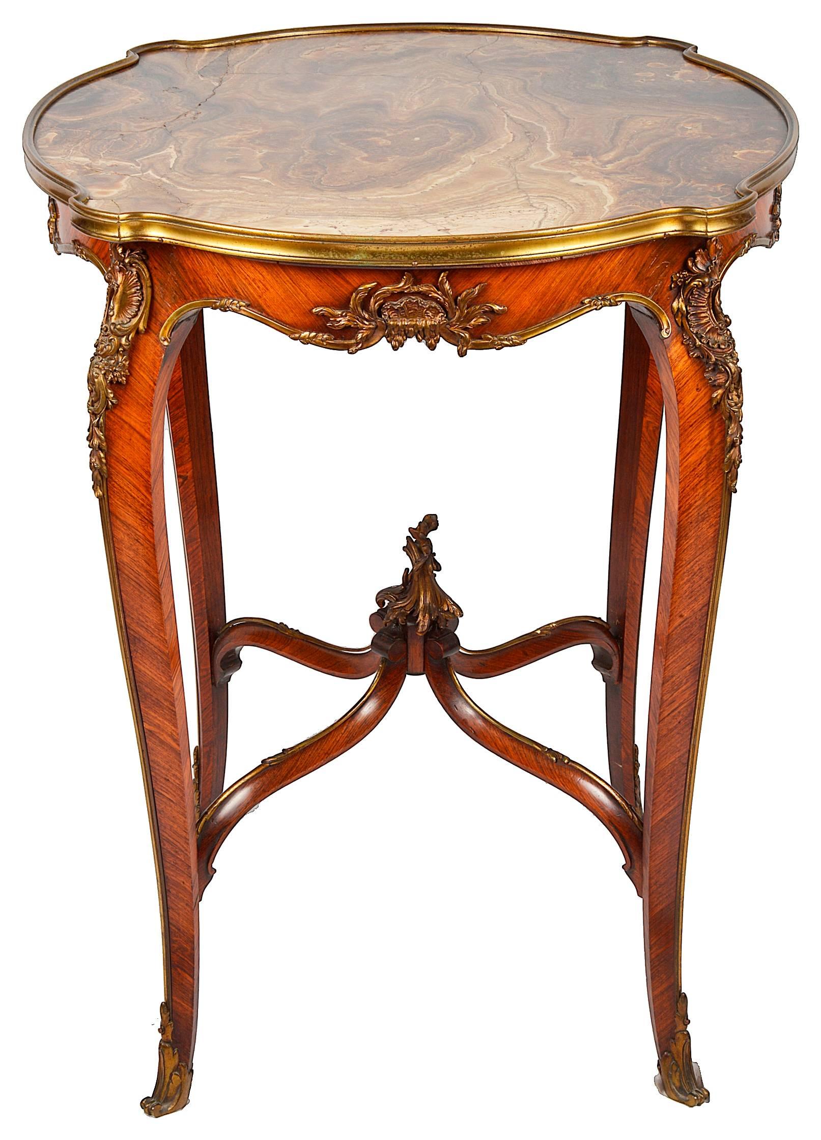 A very good quality French Louis XVI style Gueridon having an inset quarts marble top, gilded ormolu mounts, raised on elegant cabriole legs and united by a stretcher beneath.
In the manner of Linke.