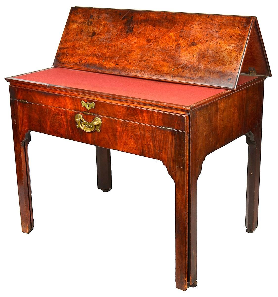 A very good quality 18th century Georgian II Mahogany architects table, having a hinged top, a sliding action compartmented drawer, raised on square section legs.