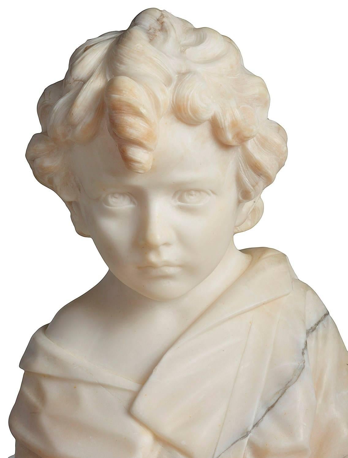 A good quality 19th century alabaster statue of a young boy seated on rock.