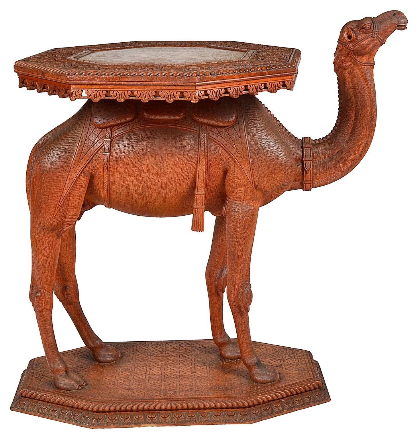 A beautifully carved 19th century Anglo-Indian carved camel table, circa 1890.