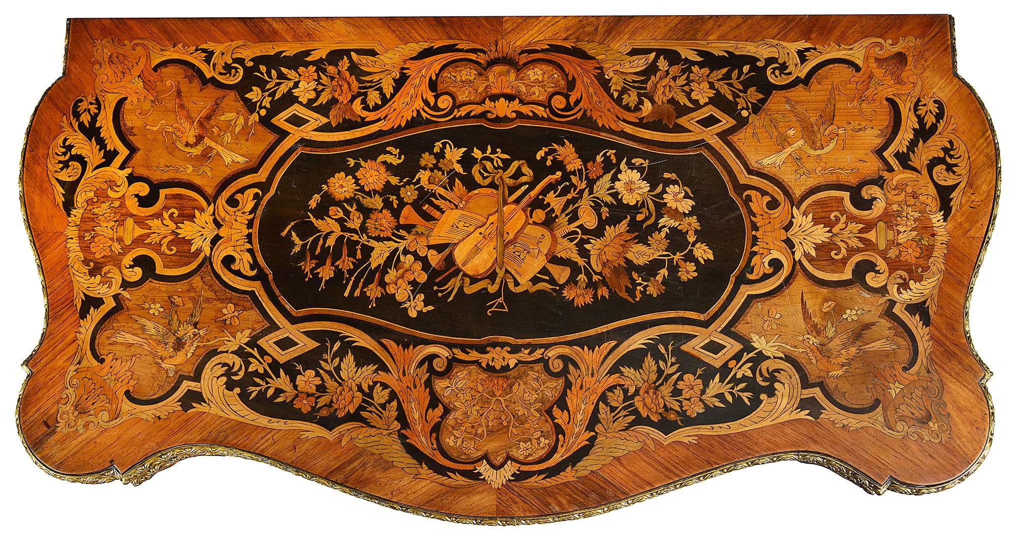 A very good quality pair of French Louis XVI style marquetry card and tea tables. Each with wonderful specimen marquetry inlaid decoration to the tops of scrolling foliage, flowers and musical instruments, inlay to the frieze, gilded ormolu mounts