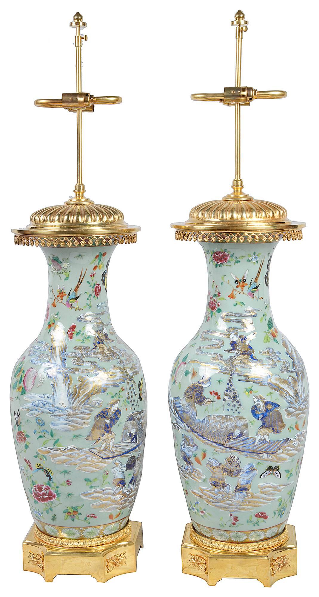 A good quality pair of Chinese 19th century Celedon vase or lamps. Each depicting exotic birds, flowers and foliage. Mounted with gilded ormolu top and base.