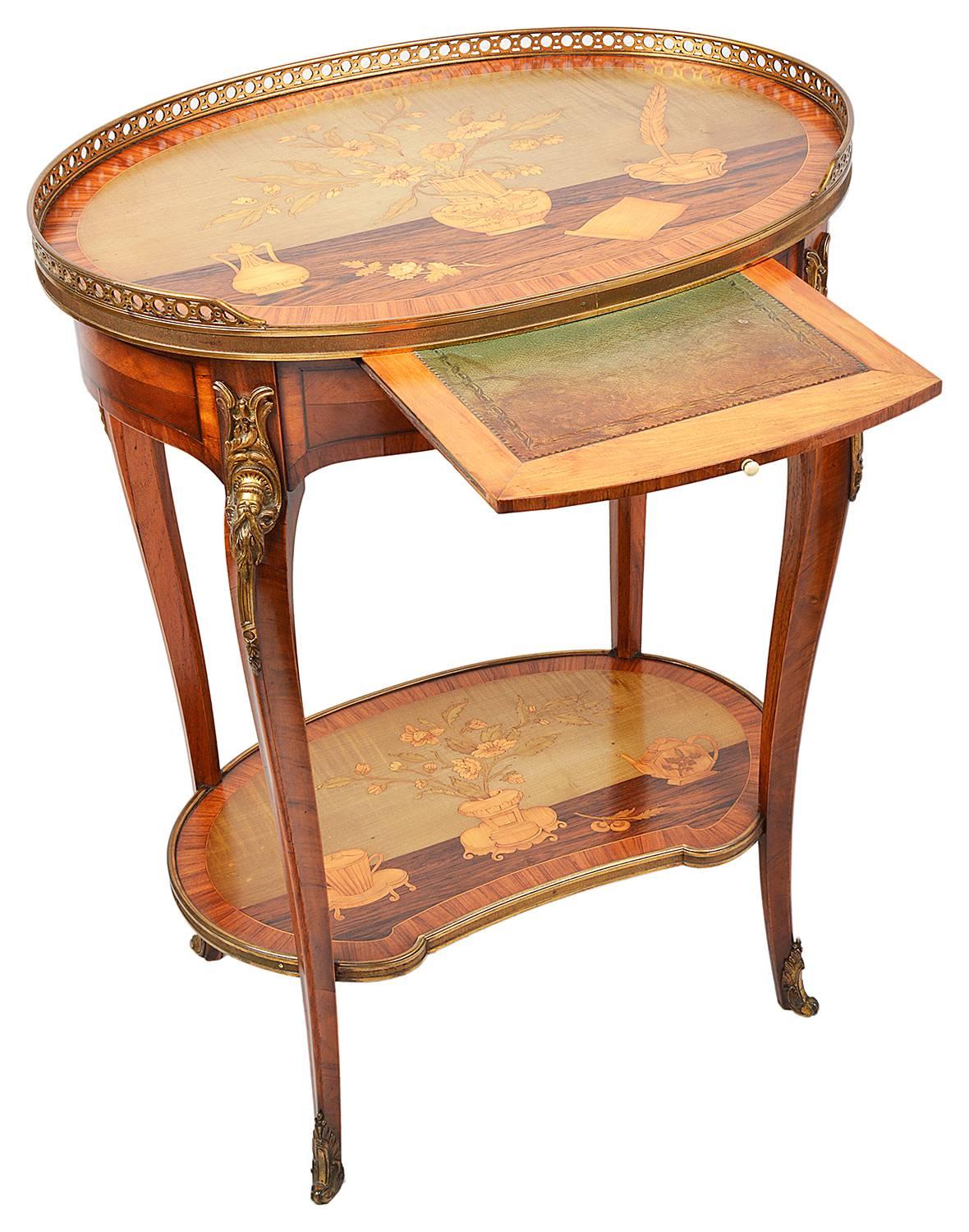 A very good quality 19th century Louis XVI style marquetry inlaid side table, in the manner of 'Topino'. Having a brass gallery to the top, inlay depicting flowers in a vase, an ink well and scroll. A leather inset slide to the frieze, raised on