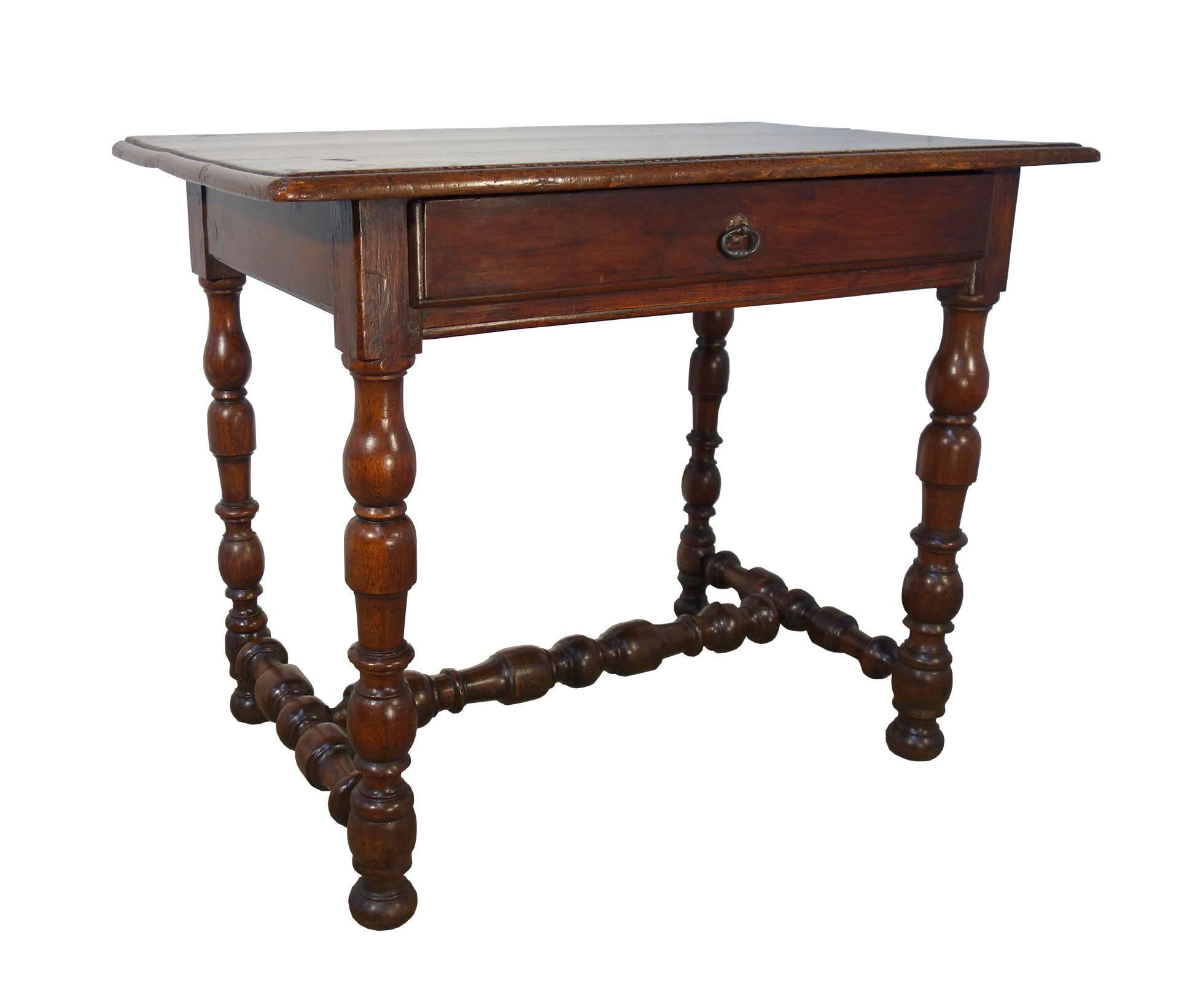Antique Tuscan side table, solid walnut, fine turned legs and a stretcher & single center drawer. Renaissance Revival, early 19th century.

Measures:
37.5