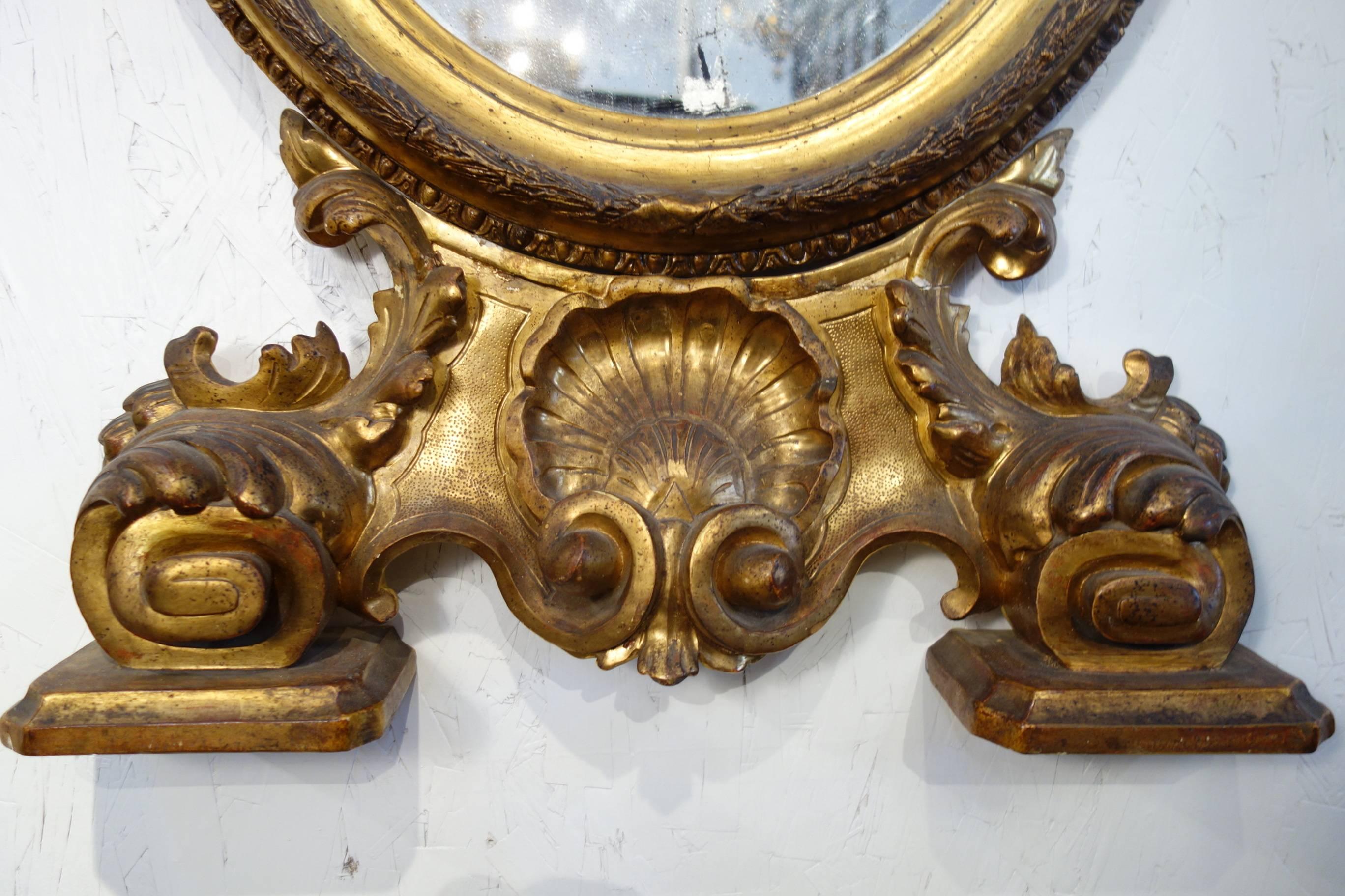 19th Century Antique Italian Baroque Style Oval Gold Gilded Mirror In Excellent Condition In Encinitas, CA