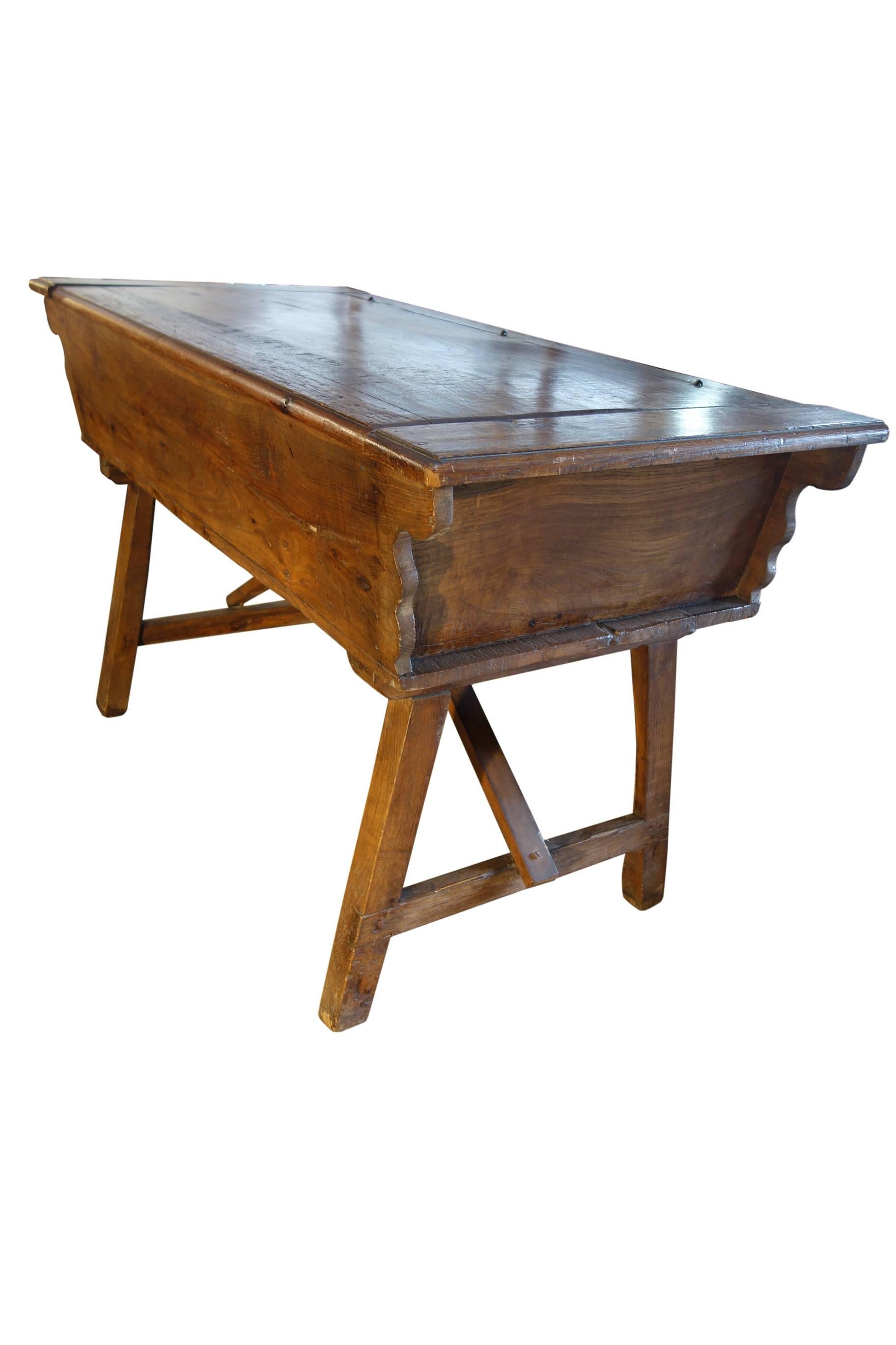 Antique Italian working table to produce and storage bread. Simple lines and solid walnut.
Dimensions: 52.6