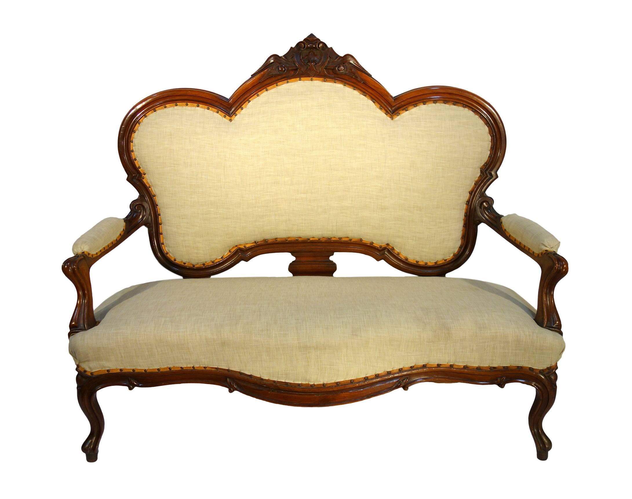 Shapely 19th Century sofa settee, solid walnut, carved coping. Piedmont, Circa 1860.  Reupholstered.

Measures: 63