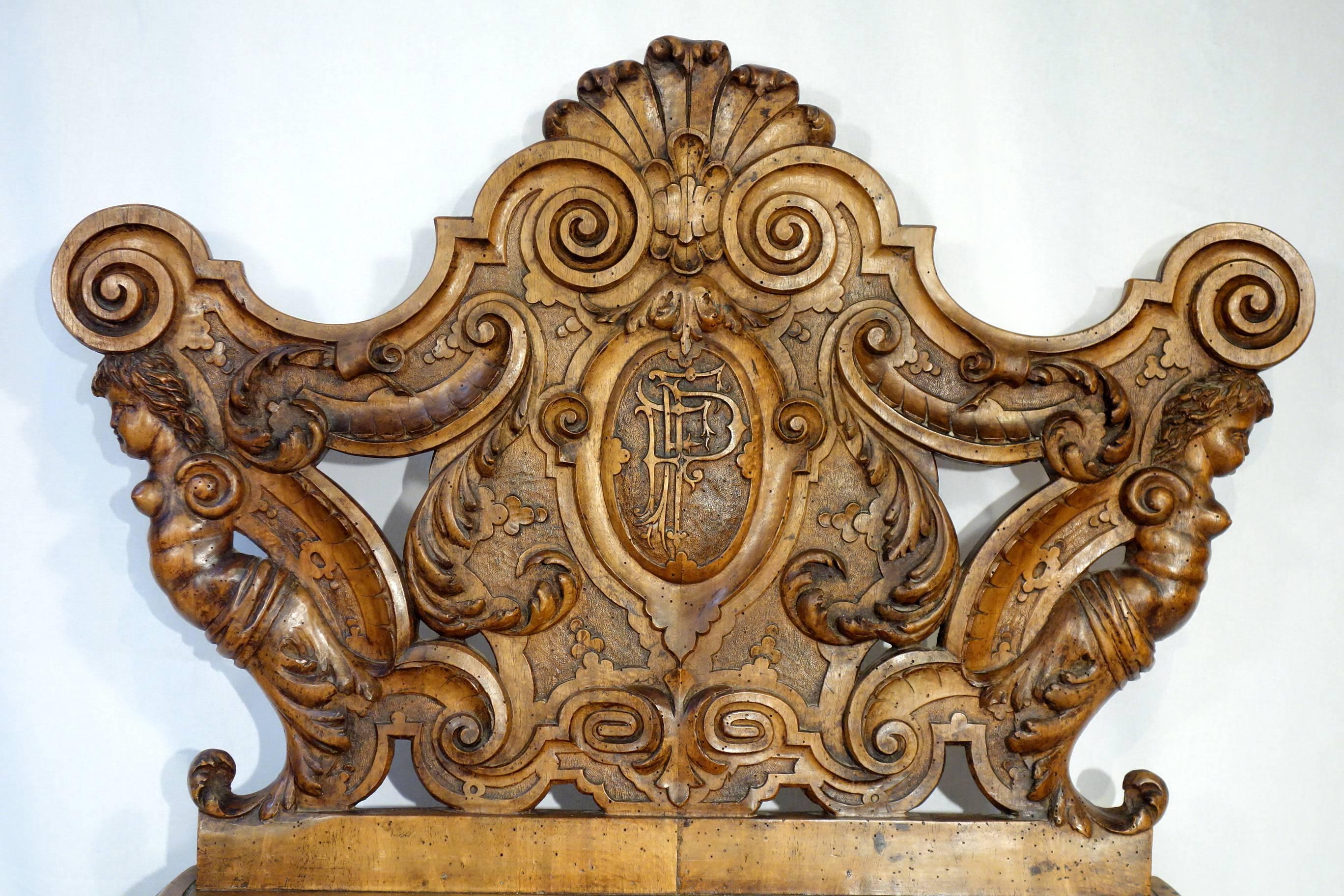 Magnificent walnut hand-carved bench attributed to master artist Valentino Besarel (b. July 29 1829, d. Dec 11 1902) of Venice, Italy.  
Renaissance Revival.  
High quality; soft, fine, deep hand carving.  Monogrammed 