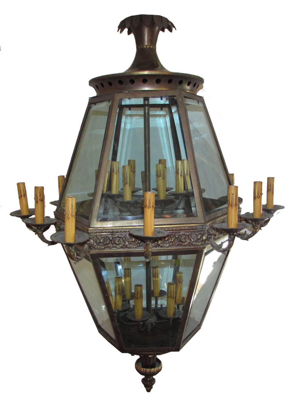 Antique Italian Monumental Pair of Louis XIV Genoa Palace Lanterns Circa 1920.
Fantastic pair of monumental lanterns, from a Genoa palace, hexagonal shape with beveled glasses. Louis XIV style, brass decorations and details. 
A total of 24 lights