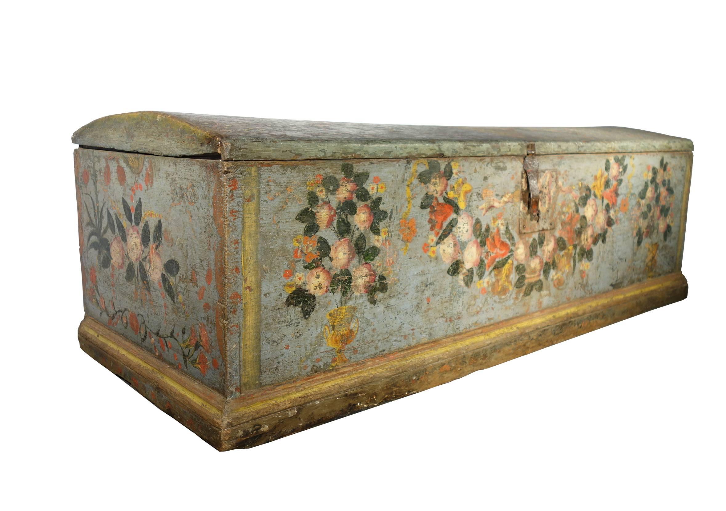 Wonderful, authentic, early 18th century Sicilian nuptial dowery trunk. hand-painted in soft aqua blue, green, red, rose, pink, orange and yellow with flower vases, draping leaf garlands, ribbon, red lilies, white roses. On the rounded lid top the