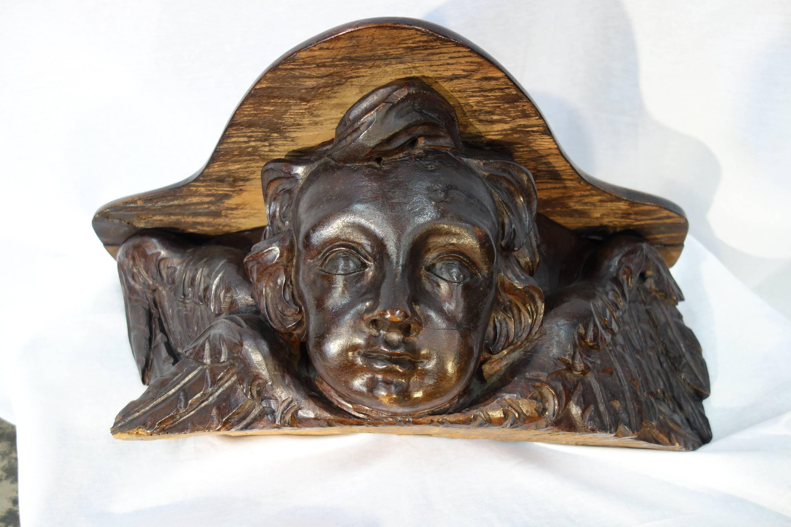 17th Century Tuscan Angel Shelf Carved from Single Block of Walnut Circa 1680.
Wonderful hand-carved walnut shelf in the shape of an angel; the top hinged lid opens up; base is fully hand-carved from a single block of walnut.