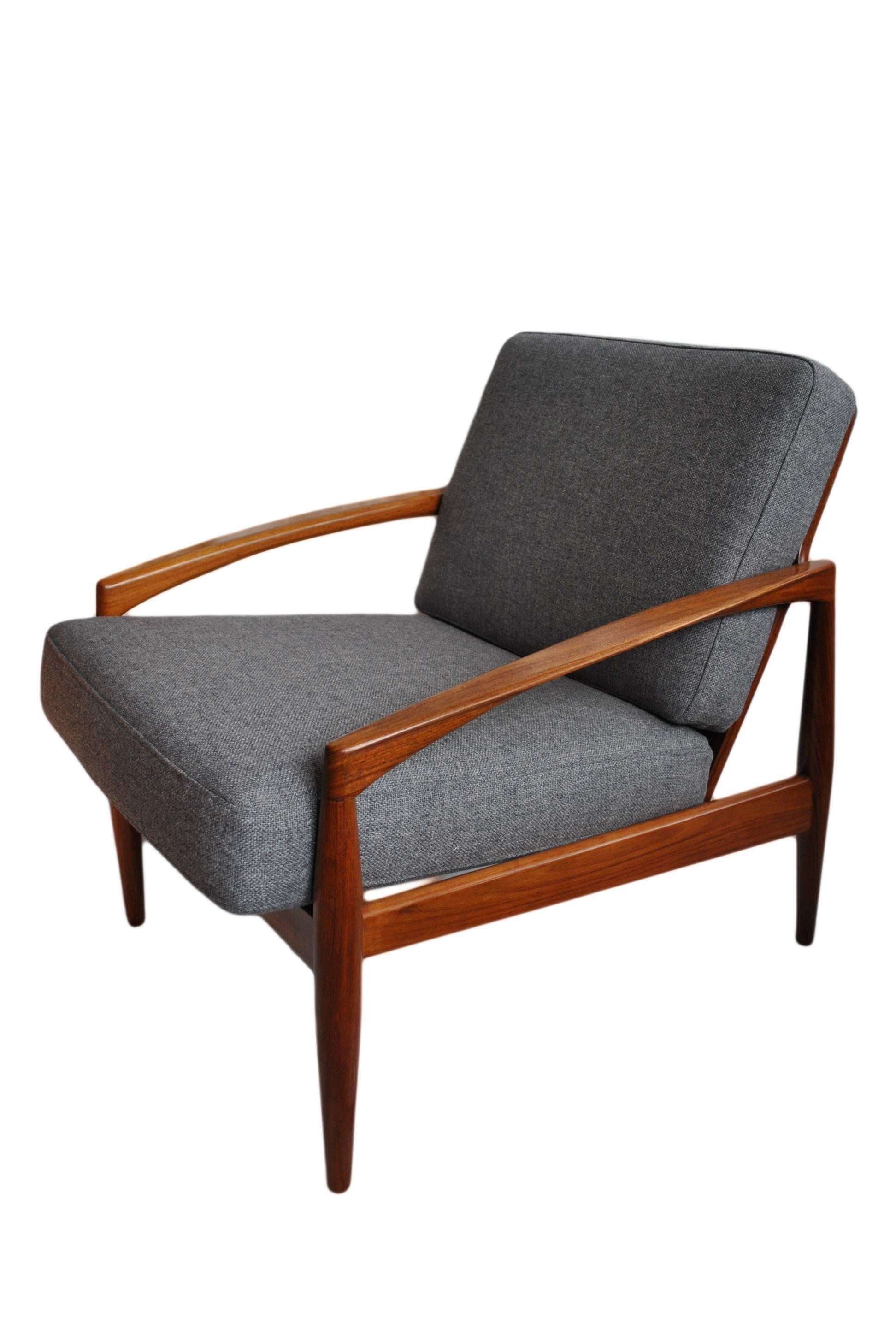 Rare rosewood paperknife armchair designed by Kai Kristiansen. Produced by Magnus Olesen, Denmark, circa 1960. Lovely light coloured rosewood -
repolished frame and with new camira weave upholstery. Other upholstery options available - please feel