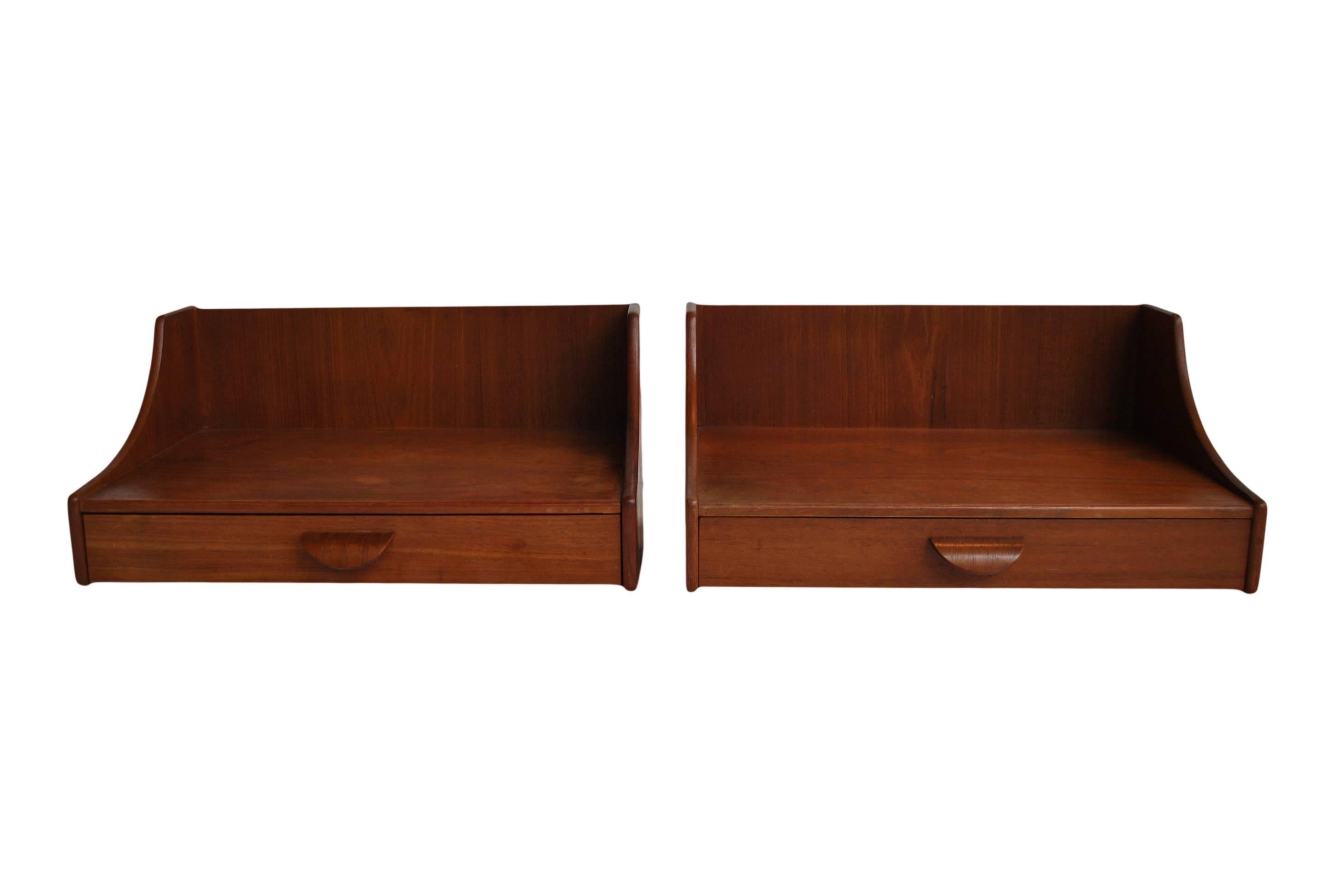 A pair of Floating Danish mid-century modern nightstands. Produced early 1960's in Teak. Clean sharp design.
