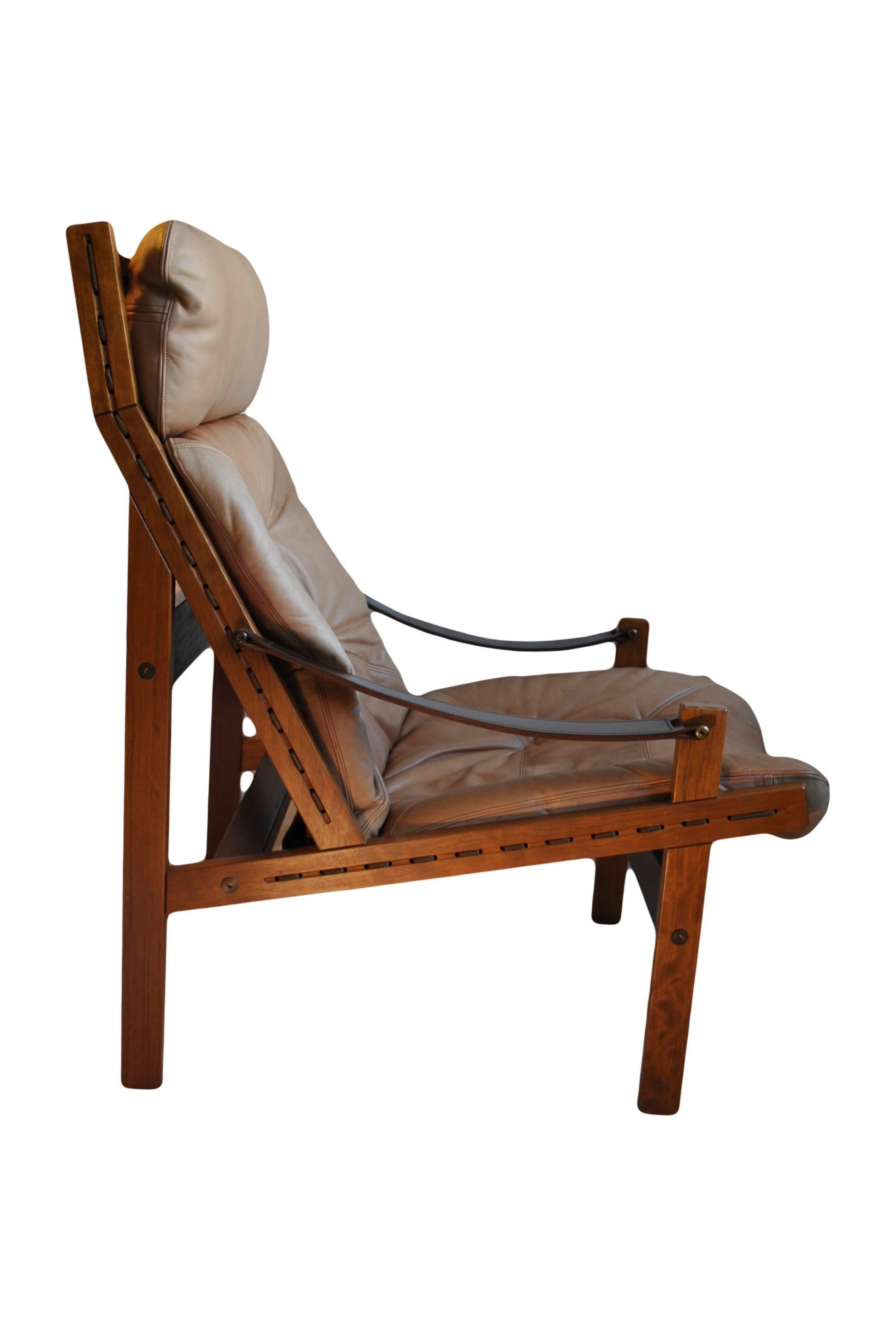 Tan Leather Hunter chair with Walnut frame. Designed by Torbjorn Afdal for Vatne Mobler, Norway, circa 1960.
Other examples available.