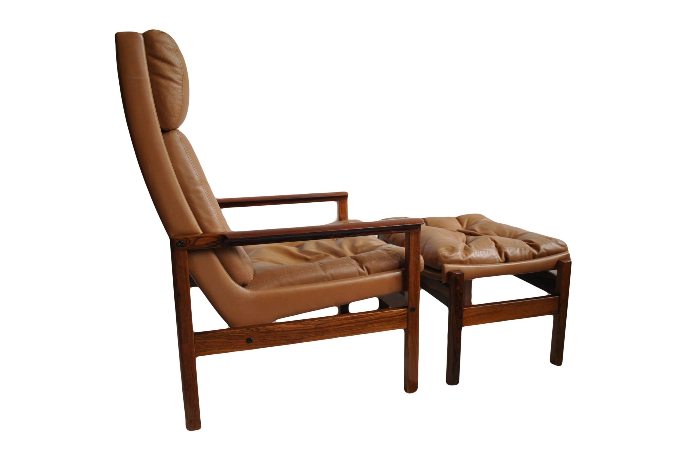 Mid-Century Modern Mid-Century leather armchair and ottoman.