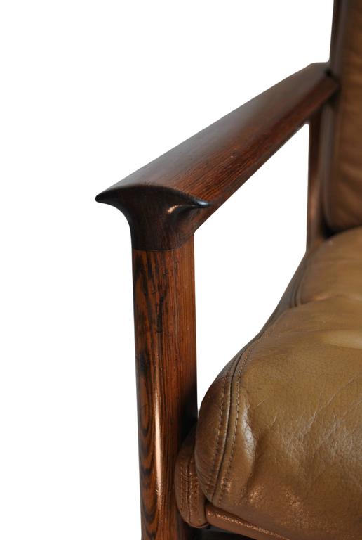 MidCentury leather armchair and ottoman. at 1stdibs