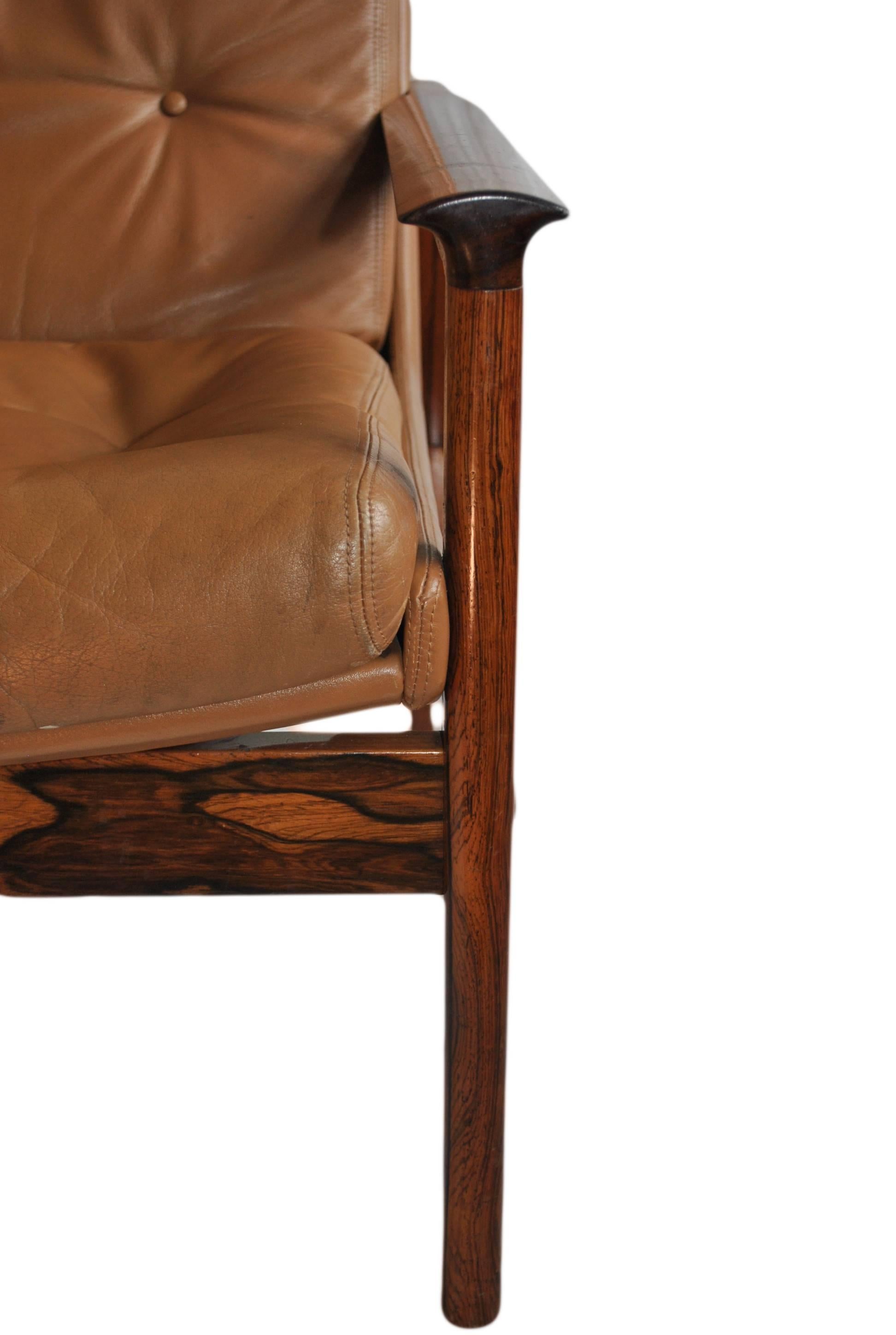20th Century Mid-Century leather armchair and ottoman.