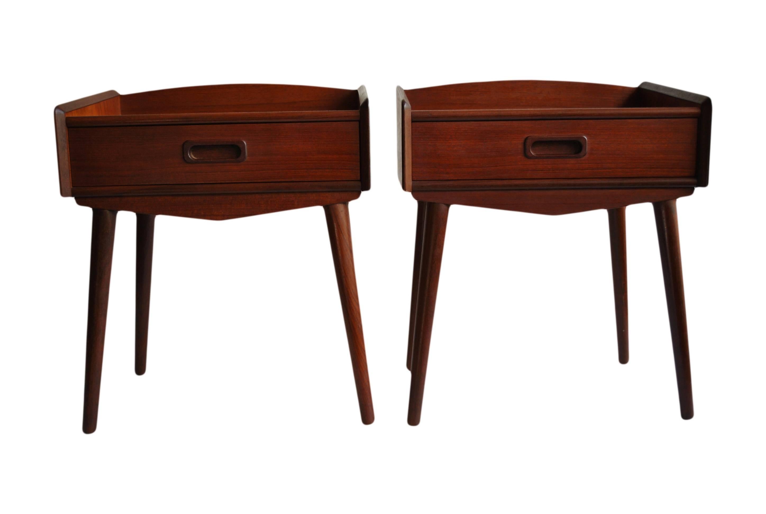 Superb pair of Mid-Century nightstands. Produced in Denmark, circa 1960. Teak and Afromosia. Fantastic condition. A matching third one is also available.