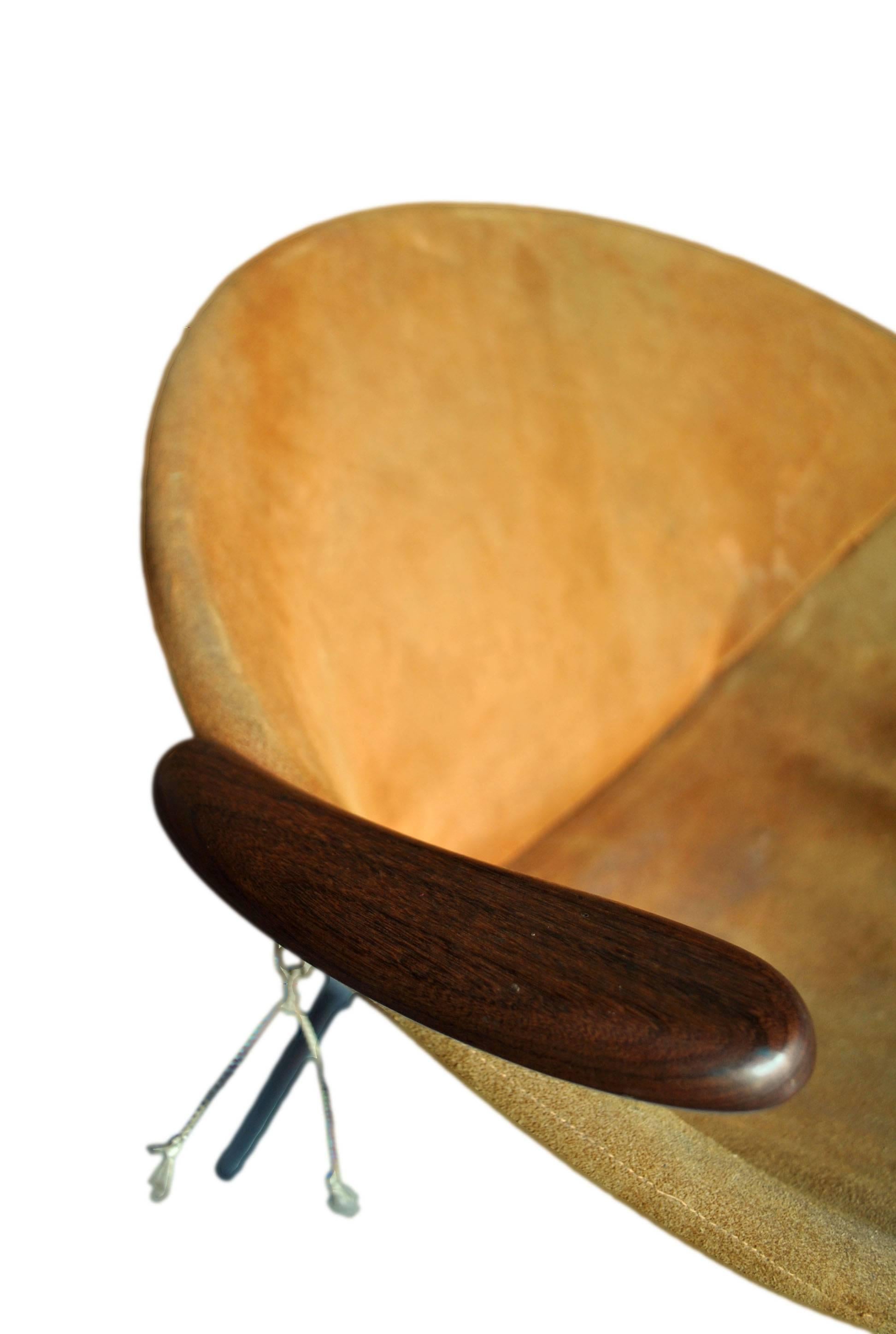 A rare balloon - or hoop - chair by Hans Olsen, circa 1955, Denmark.
All original tan suede upholstery (we can change this if another colour is required) metal frame with dark teak arms.
 