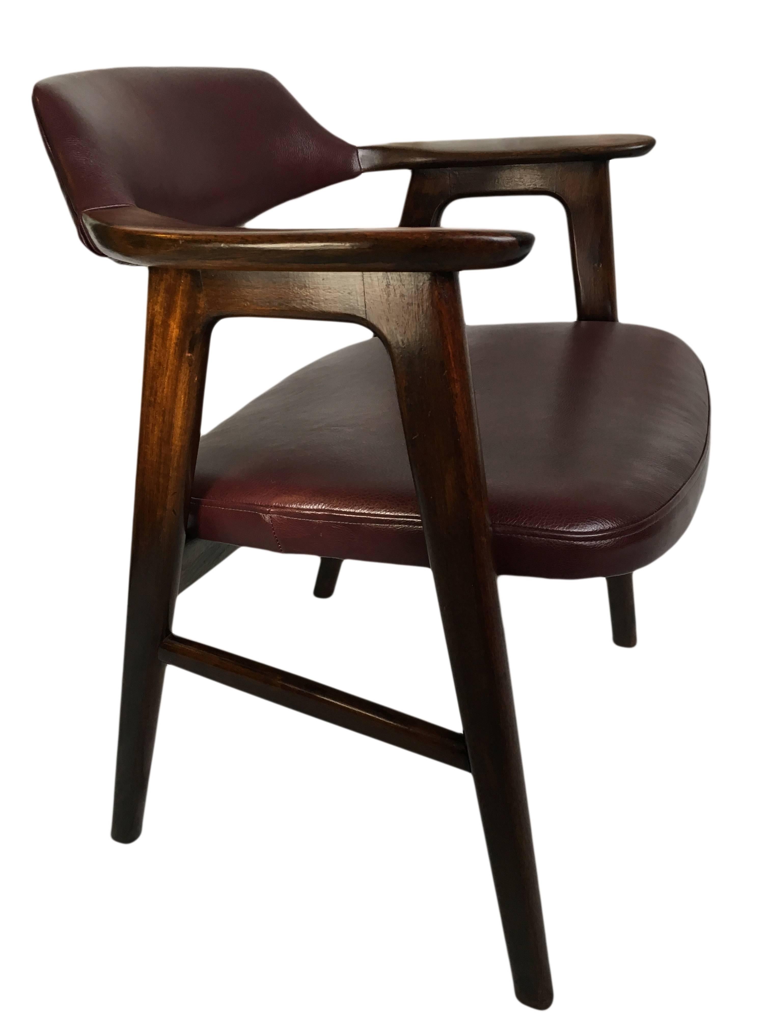 Superb quality rosewood armchair or desk chair by Erik Kirkegaard. New burgundy leather uupholstery.
Produced in Denmark, circa 1955.