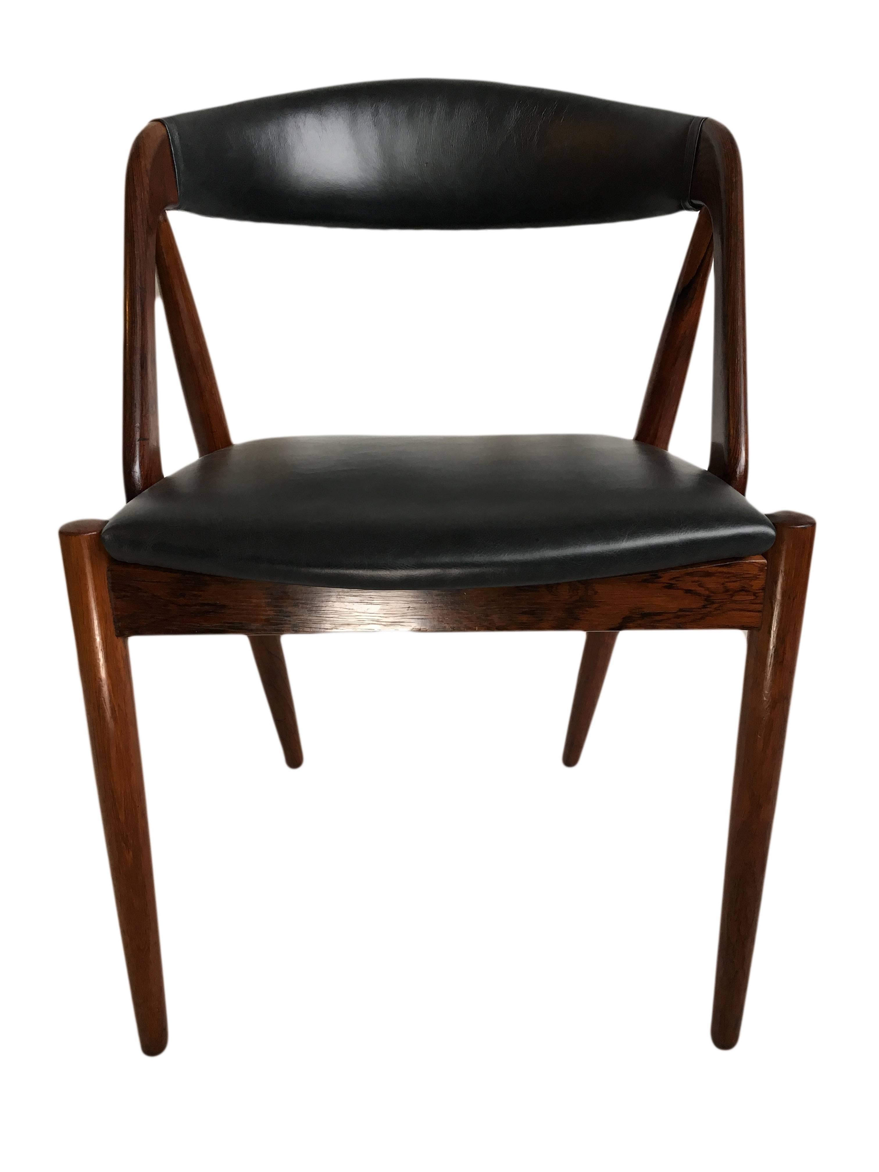 Mid-Century Modern Fully restored set of 4 Rosewood Kai Kristiansen Dining Chairs.