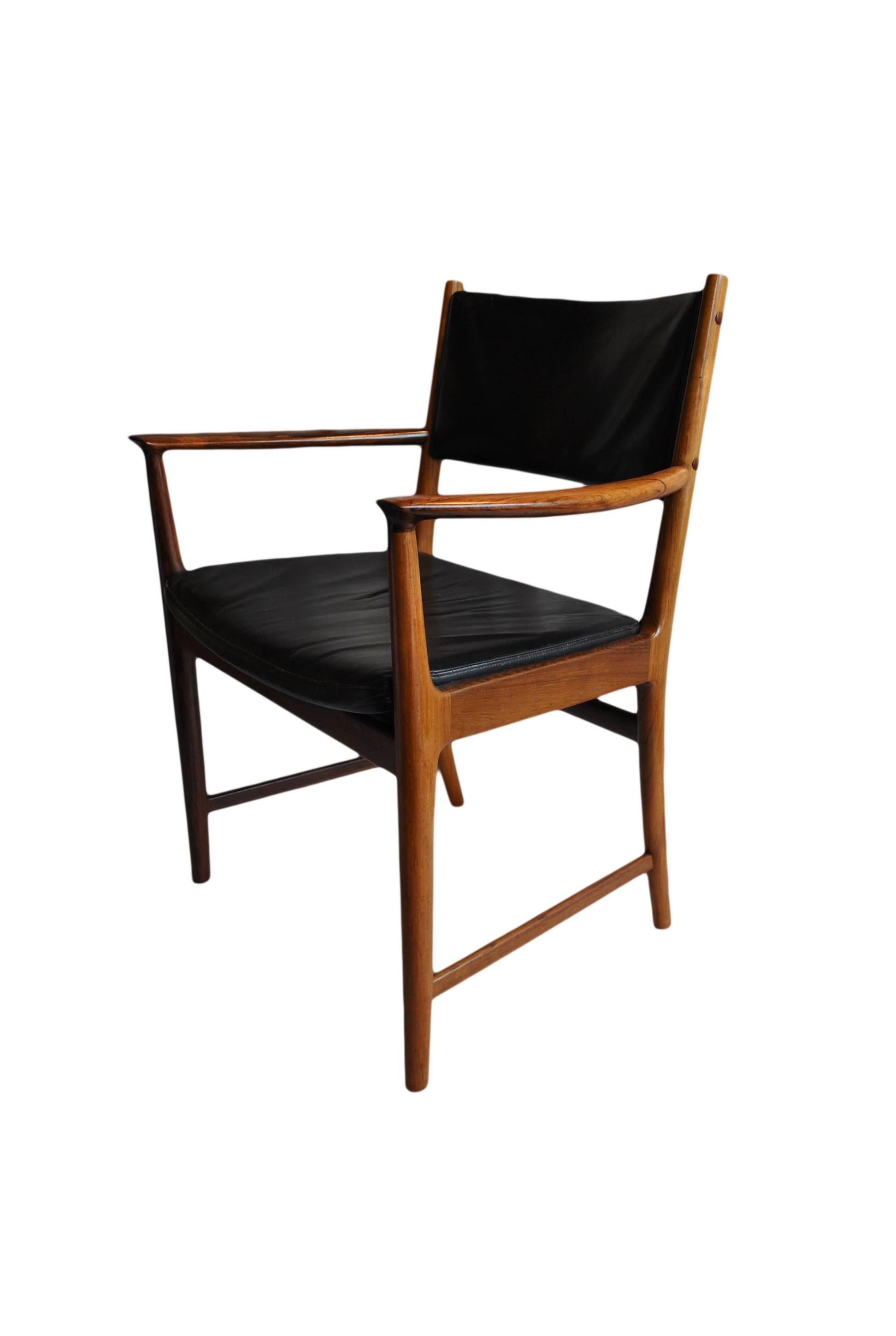 A wonderful example of this rare Kai Lyngfelt Larsen chair. Superb rosewood and original (we can reupholster in any colour if required) leather upholstery. Produced by Soren Willadsen, Denmark, circa 1960.
           