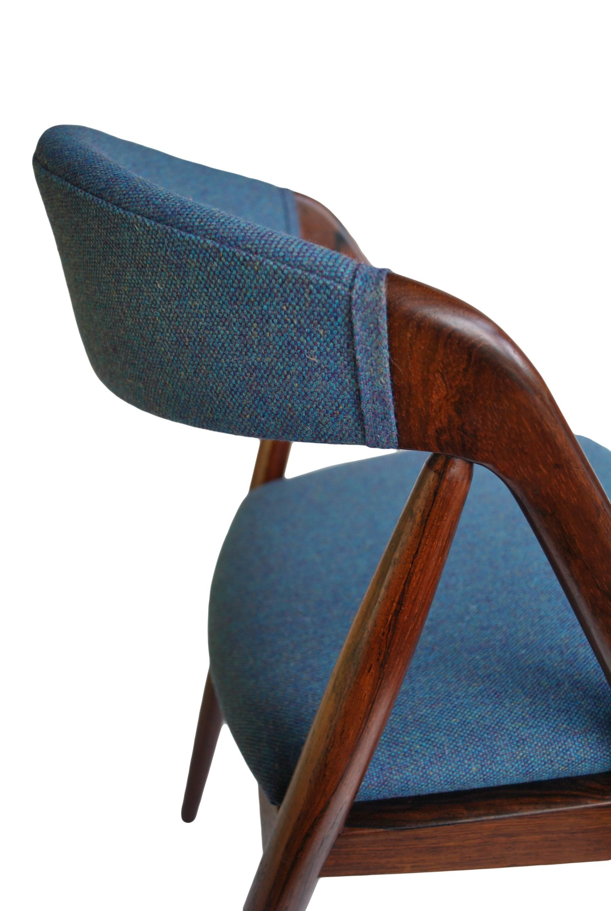 A set of eight increasingly rare model 31 dining chairs. Designed and produced in the 1960s by Kai Kristiansen. Wonderful coloured and grained Santos rosewood frames.
These have been repolished and professionally re-upholstered in a tower blue