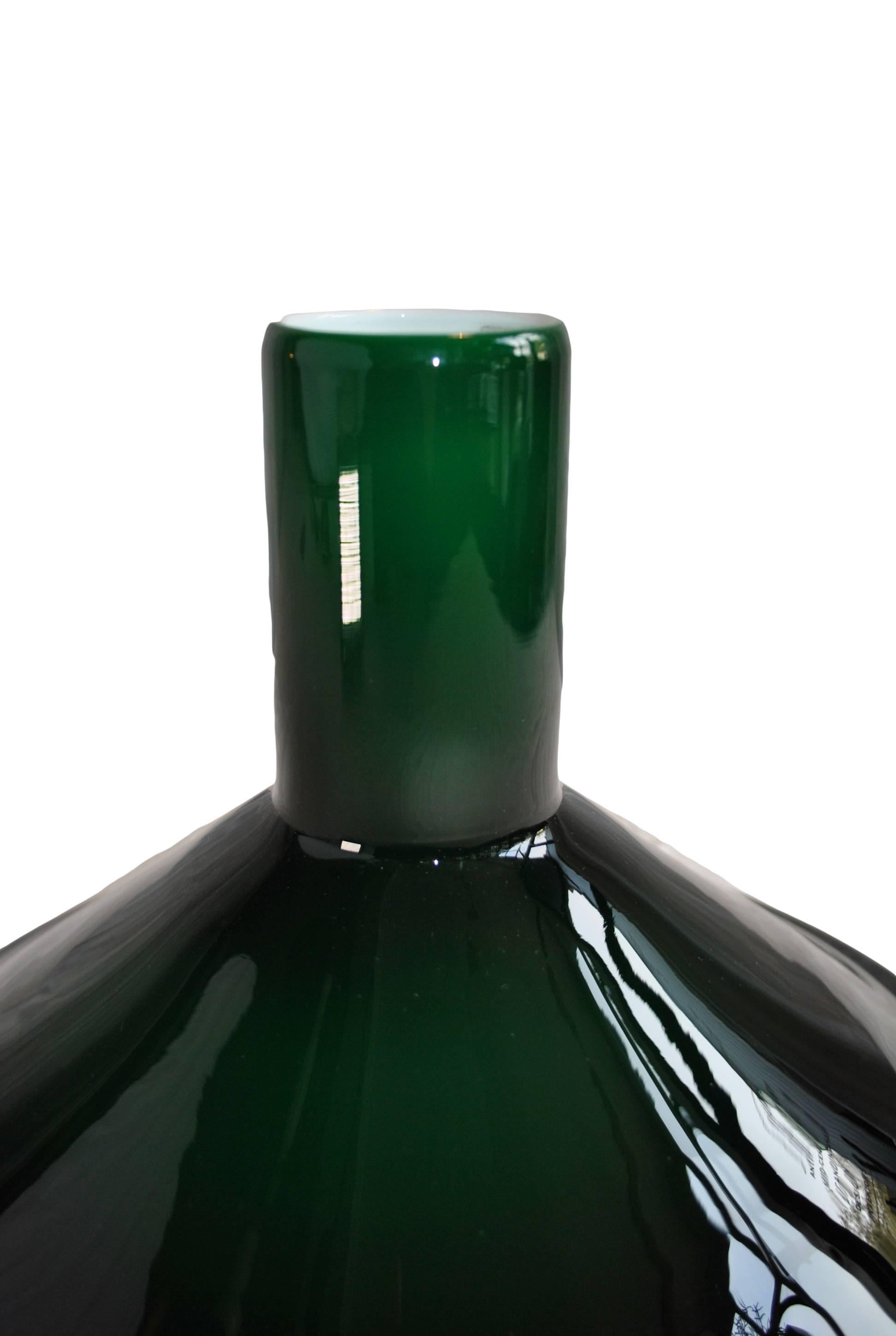 A pair of P&T pendant lights designed by Michael Bang for Holmegaard, 1972.
Green Holmegaard glass with white inner casing.
We currently have a total of four in stock.