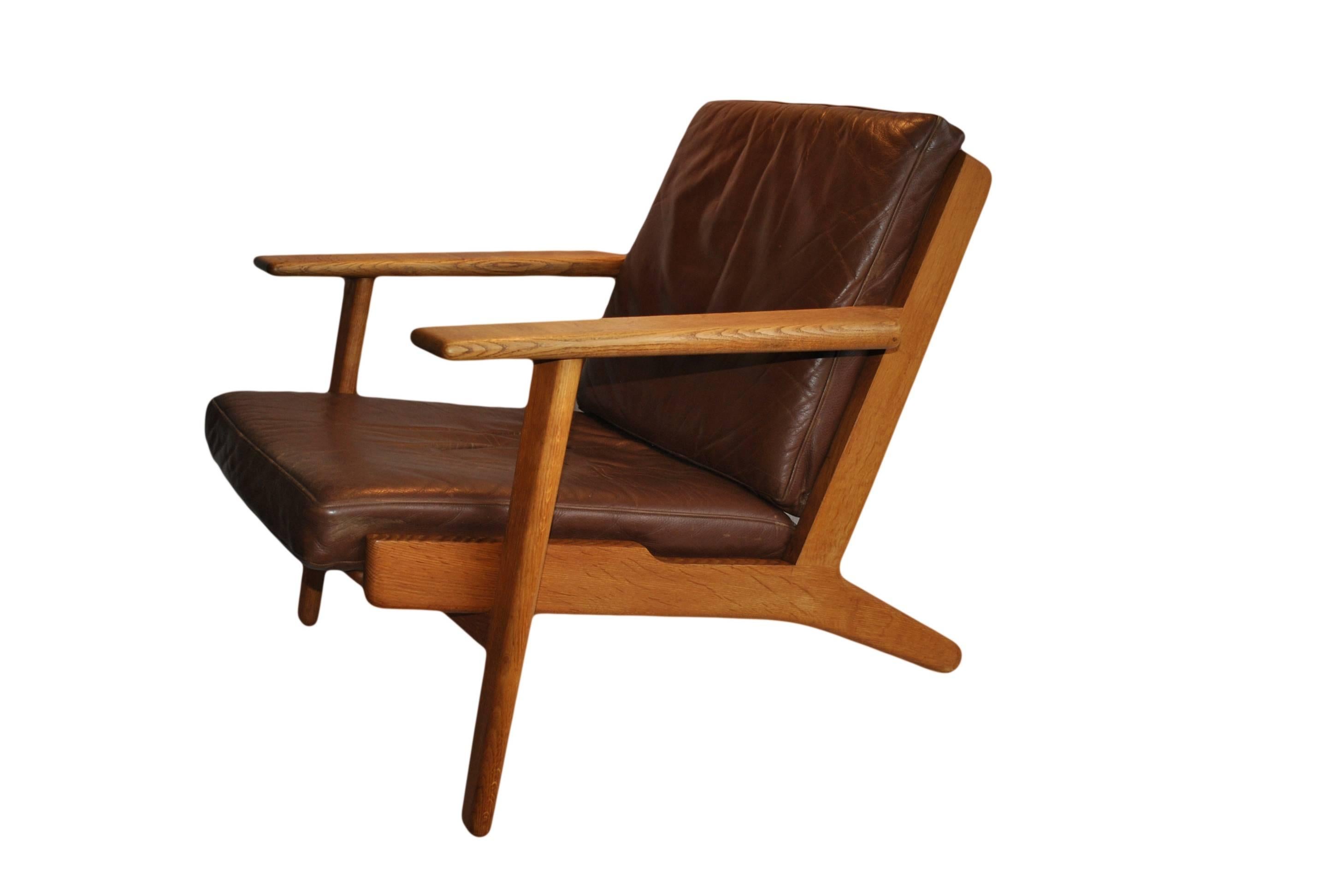 20th Century Pair of Hans J Wegner ge290 Oak Lounge Chairs, 1950s. Refurbished.