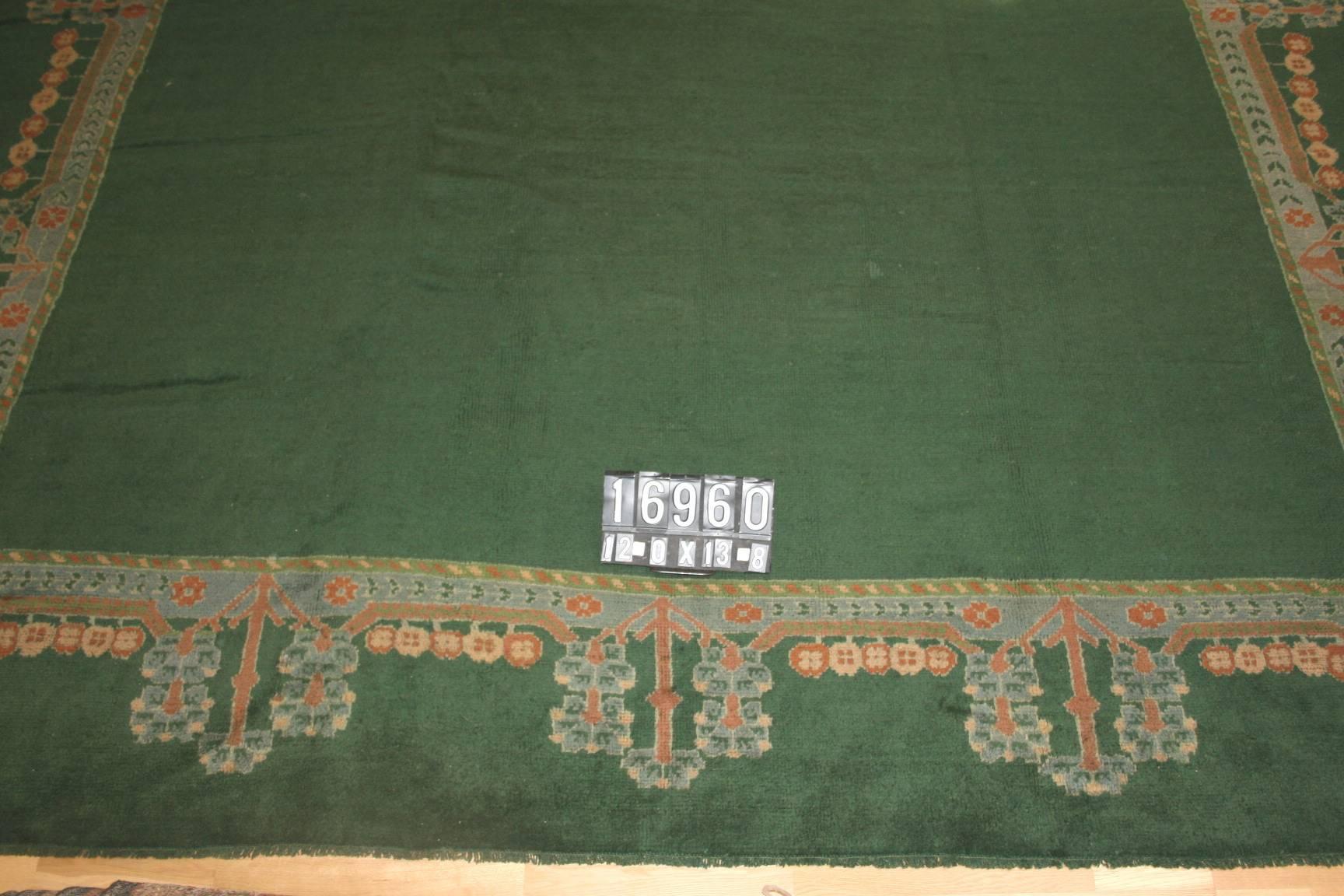 This carpet is a very unique antique Turkish Ushak woven in the workshops of Central Turkey in the Ushak district. The piece was woven, circa 1900. It was a commissioned example of an early Ottoman piece with the fluted border of floral links