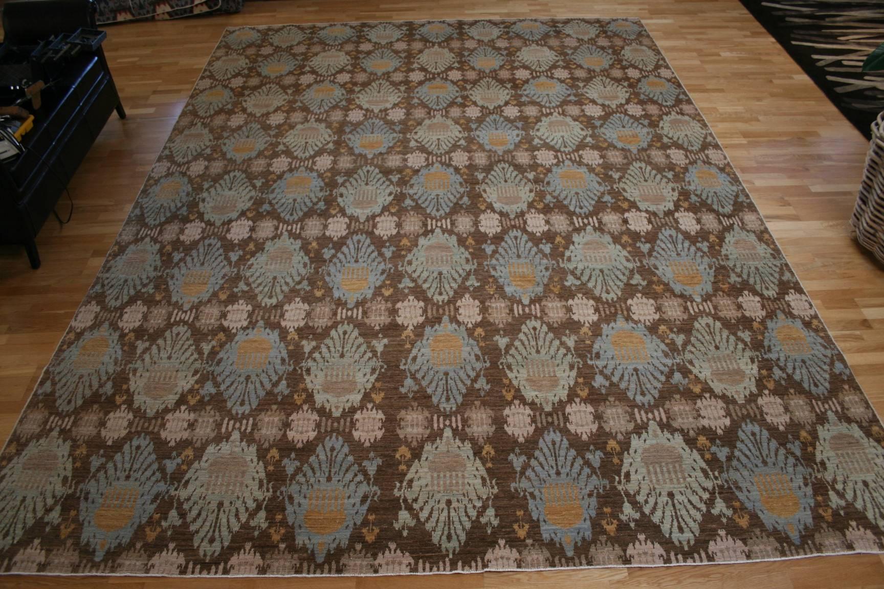 Woven in the Northern regions of Afghanistan, of the finest quality, high mountain wool, this rug is one of the most decorative examples of Afghan weavings produced today. The design is an adaptation of the famous Ikat fabrics and textiles from
