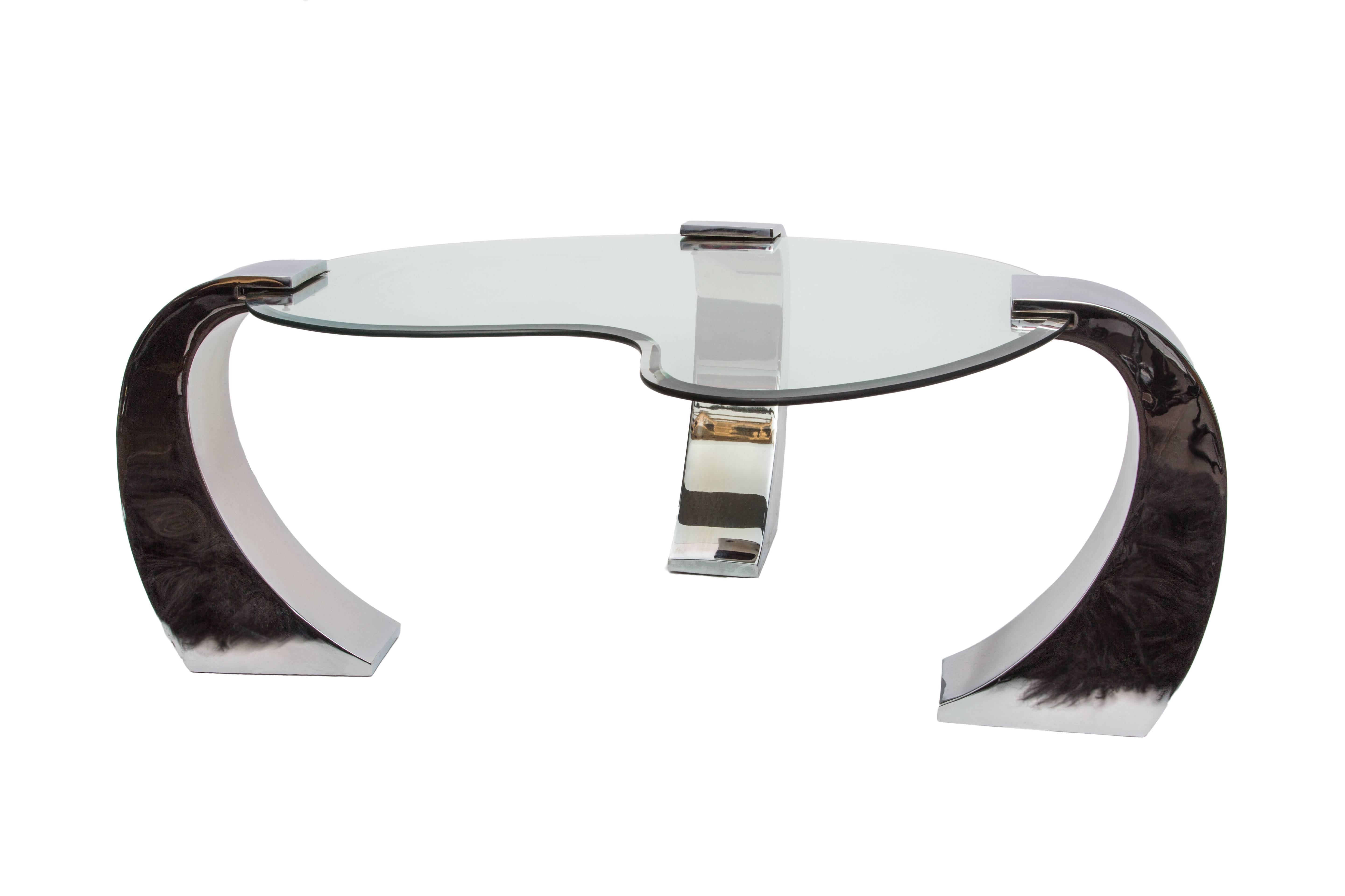 An elegant and unique Mid Century Modern kidney shaped glass and chrome  plated coffee table with 3 interchangeable legs and 1/2'' thick beveled glass top. 
This unique coffee table is essential for any contemporary design enthusiast. 
