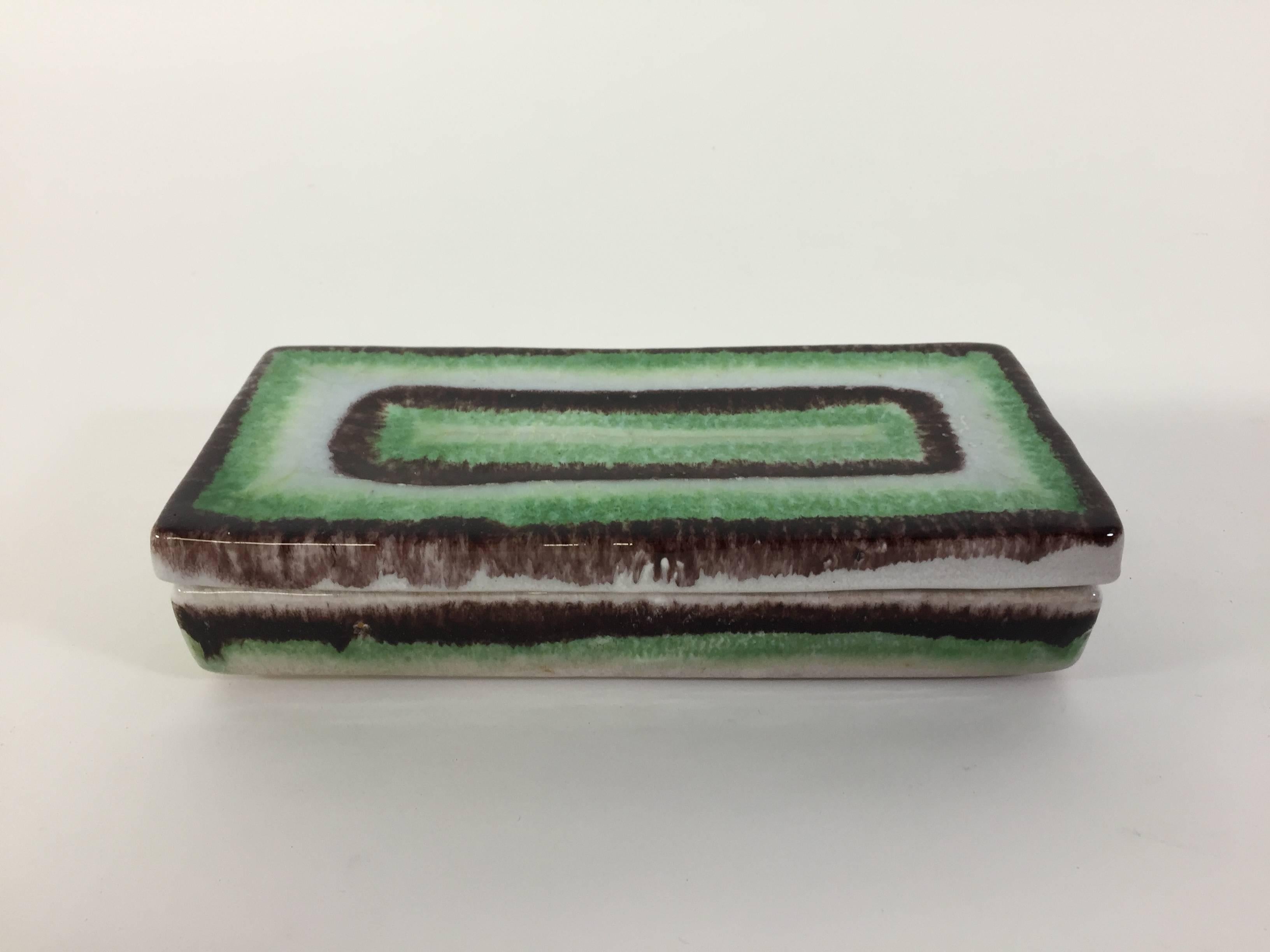 Fully signed art pottery box for desk or tabletop. Beautifully decorated with a minty green, white and aubergine glazes, circa 1950-1960. Bellini mark on Raymor label.