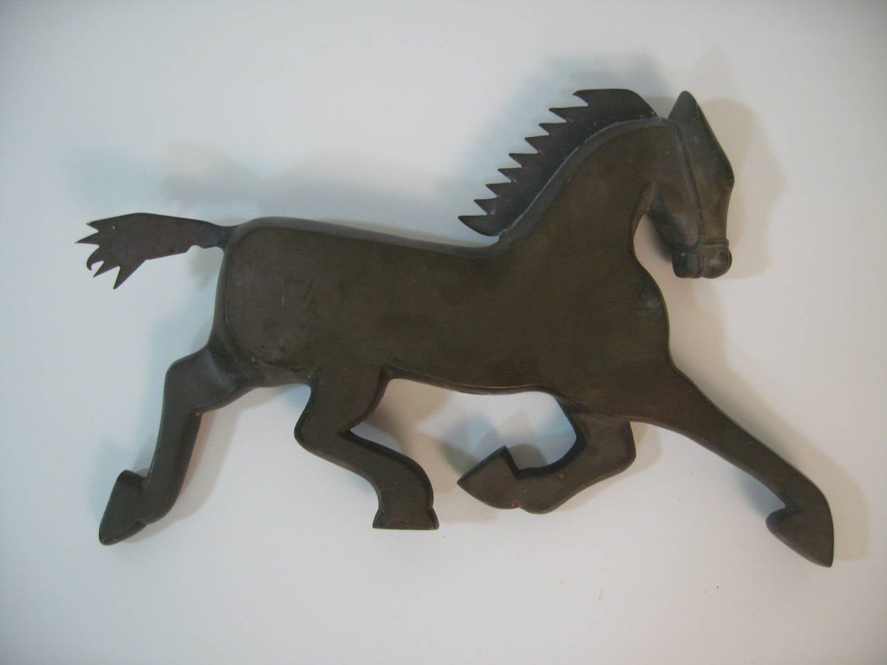 Wonderfully stylized figural Art Deco fragment of a prancing horse. Solid bronze, circa 1920-1930. Measure: 16.5