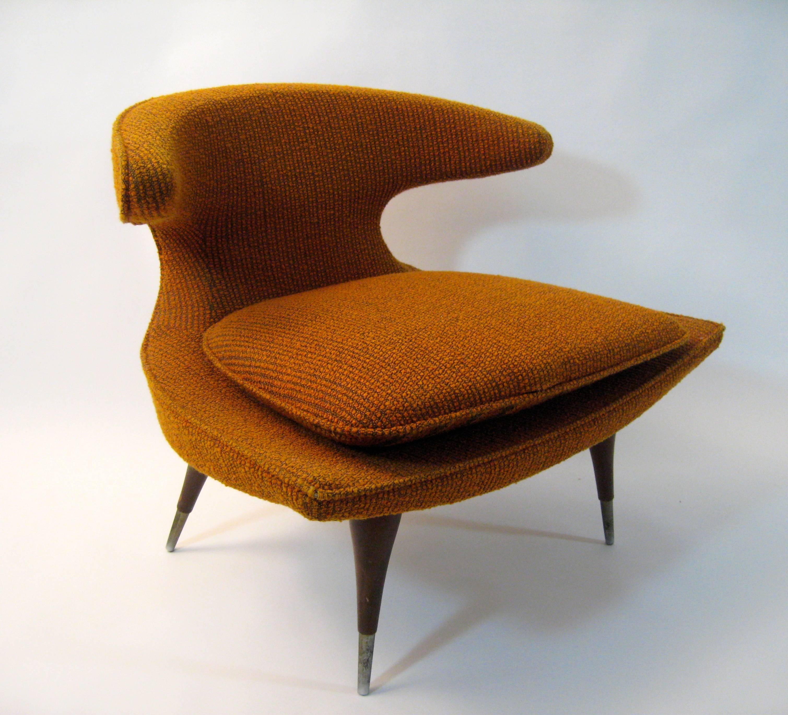 Exciting Atomic Era slipper chair made by Karpen of California.  The Horn Chair still retains its amazing burnt orange nubby fabric.  The seat cushion can be turned over displaying a different design. Bulbous tapering legs ending in aluminum sabots.