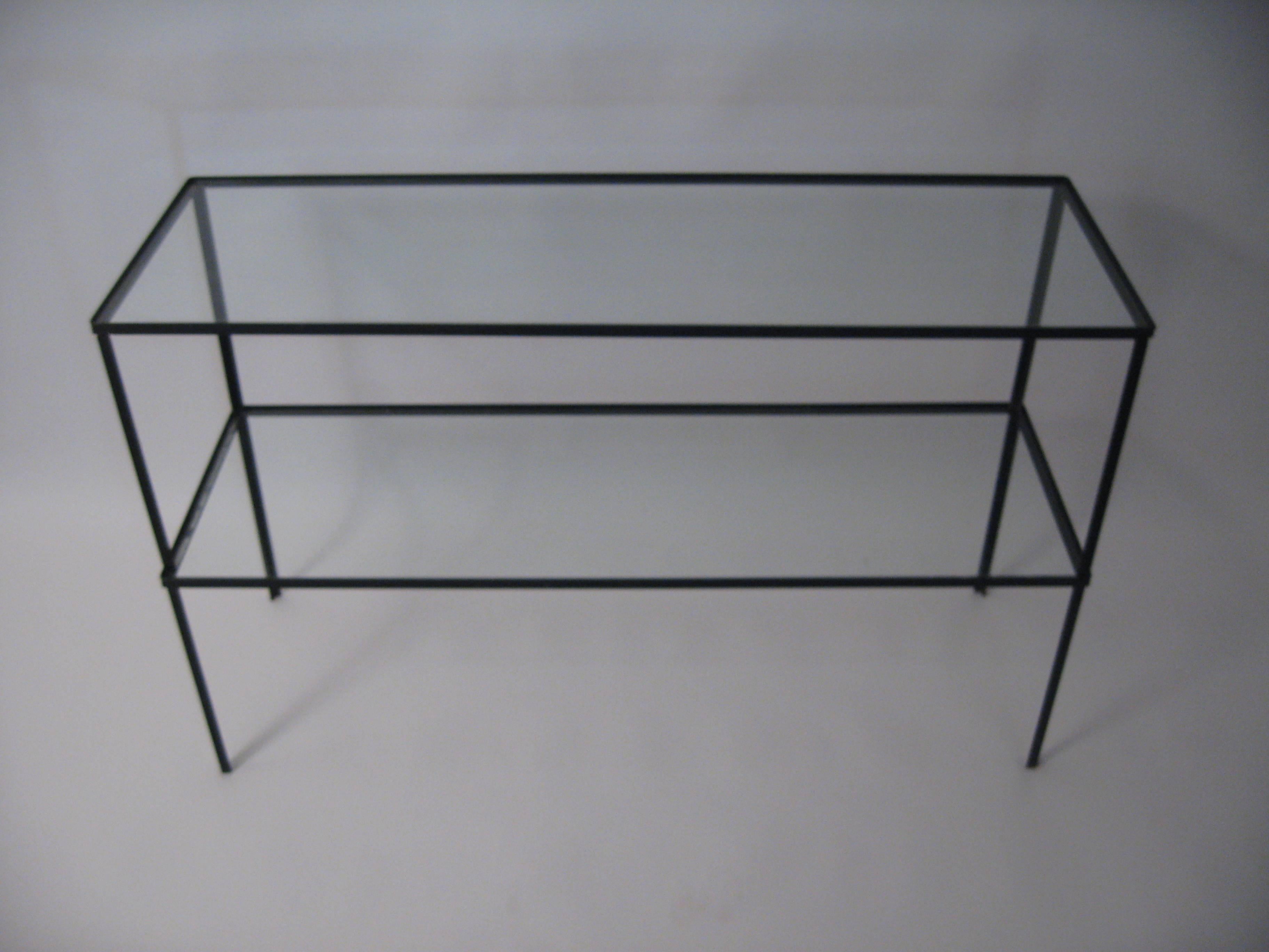 Pair of Frederick Weinberg angle iron and glass standing shelves.  Black enamel and glass. 