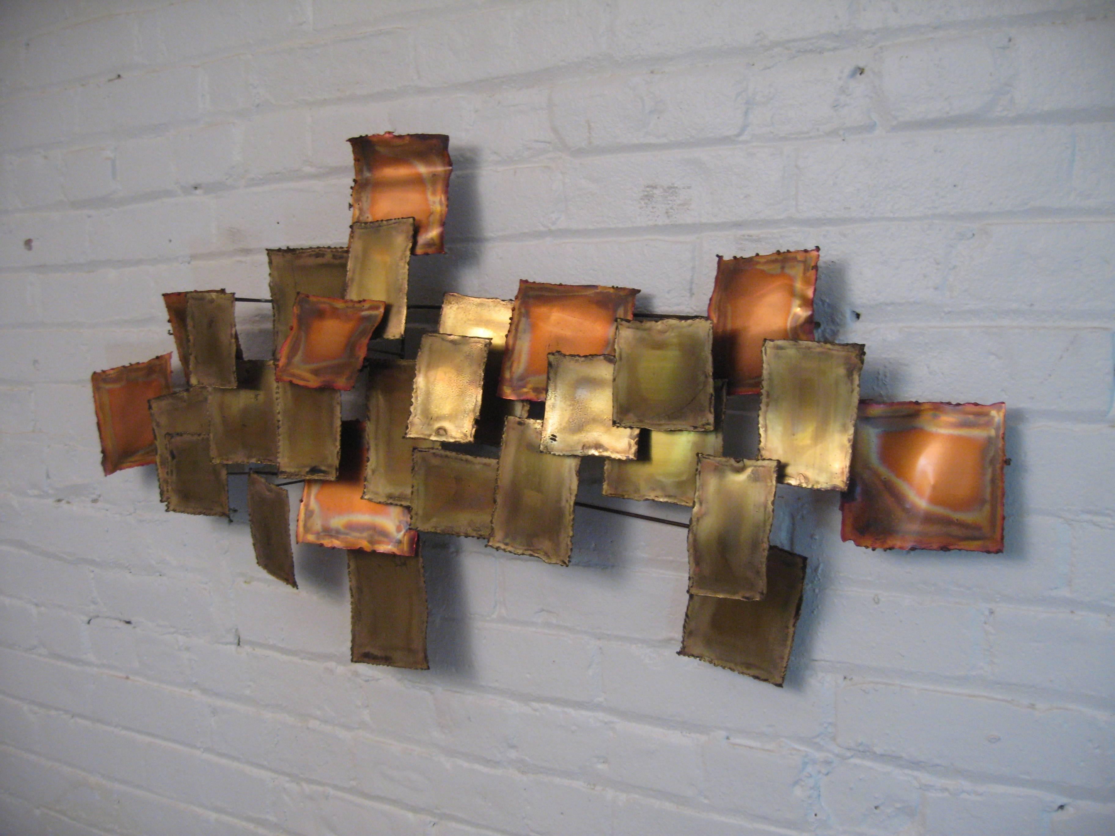 Warmly patinated copper period wall hanging. Tiered and layered cut copper metal squares and rectangles. Illegibly signed. Excellent condition.