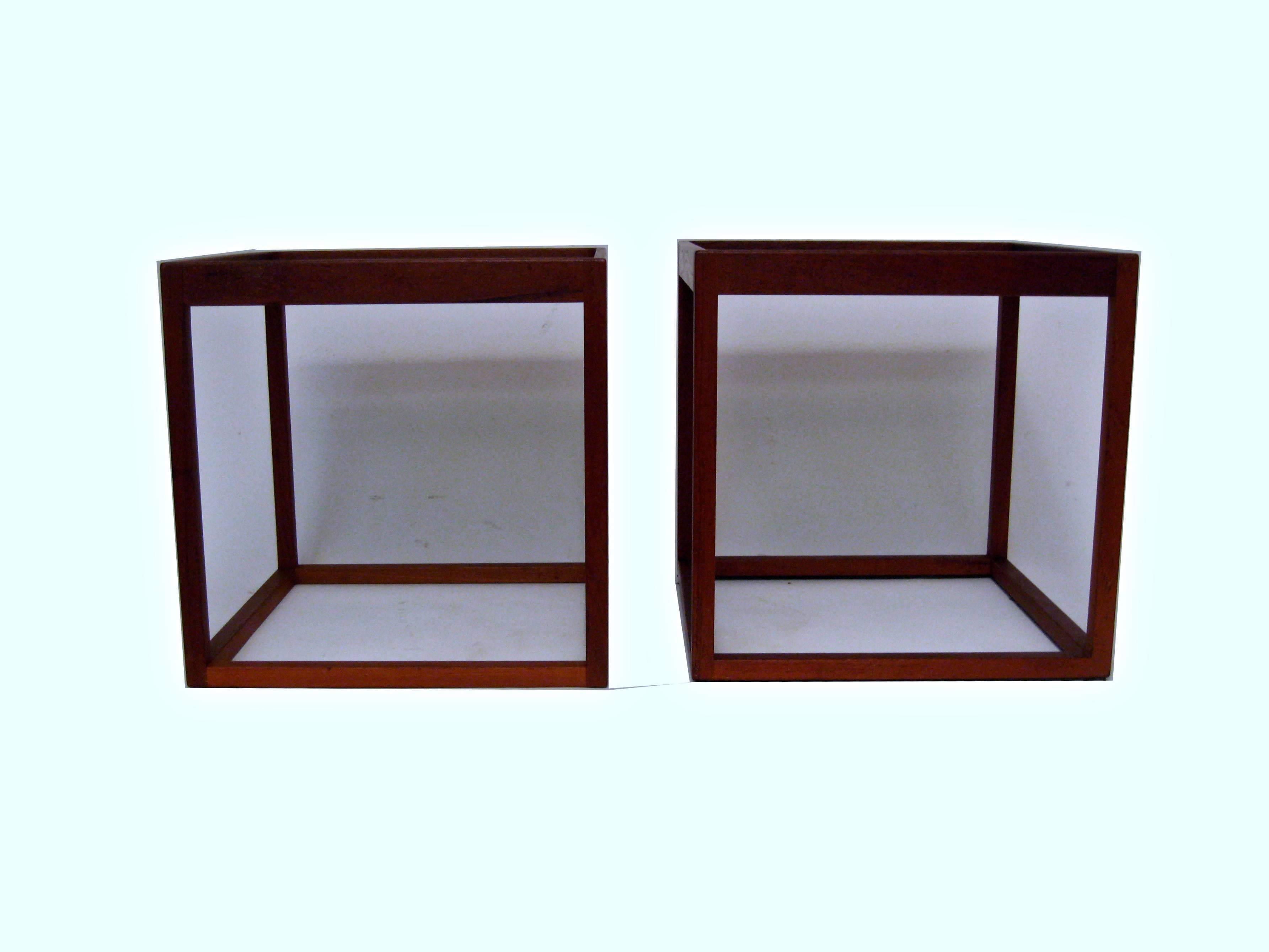 Solid teak frames with smoked glass tops in the manner of Henning Norgaard. Very good, original condition. Unsigned.
