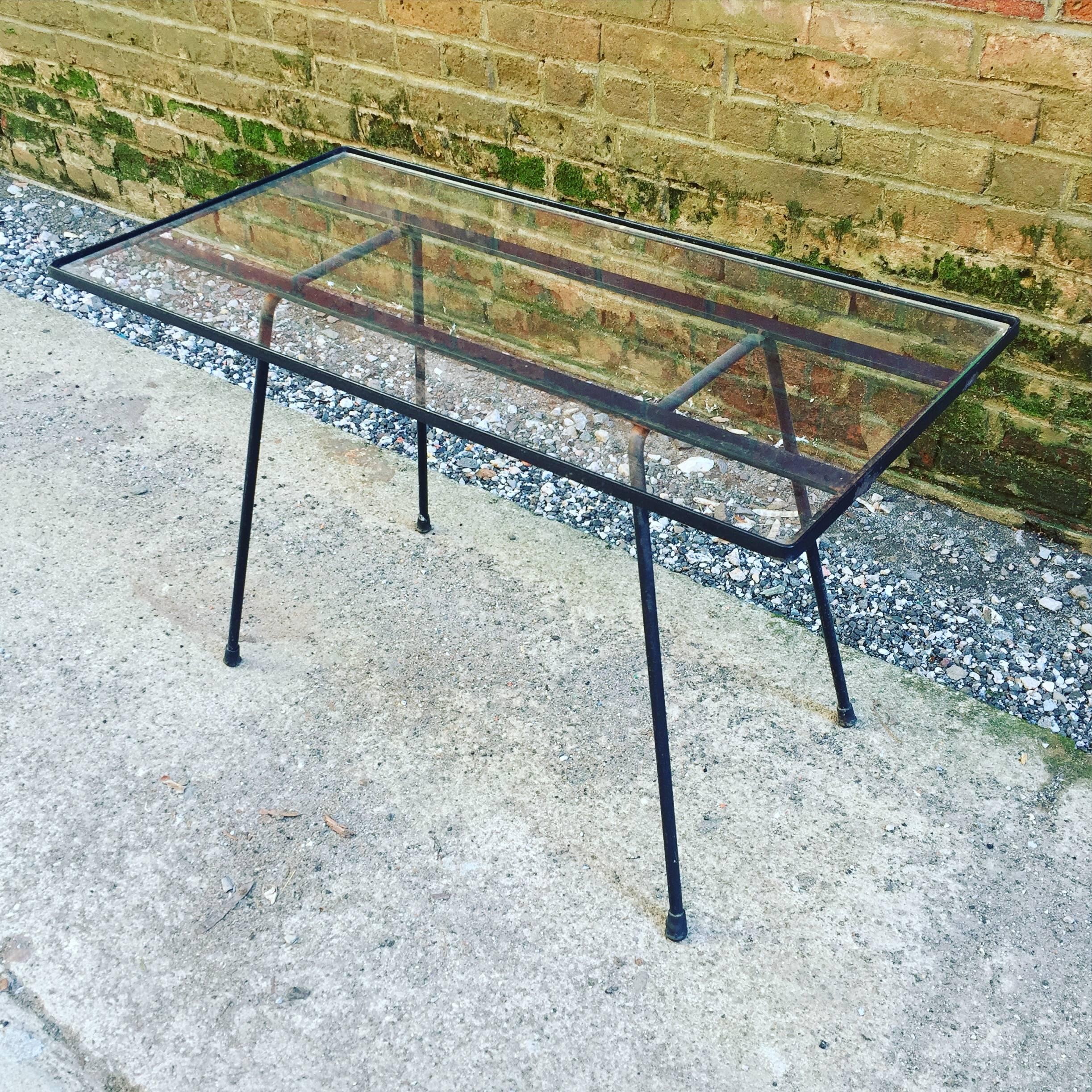 Simple and good iron and glass side table. Reminiscent of Paul McCobb design. Iron frame with glass insert. Round rod splayed legs. Nice scale.