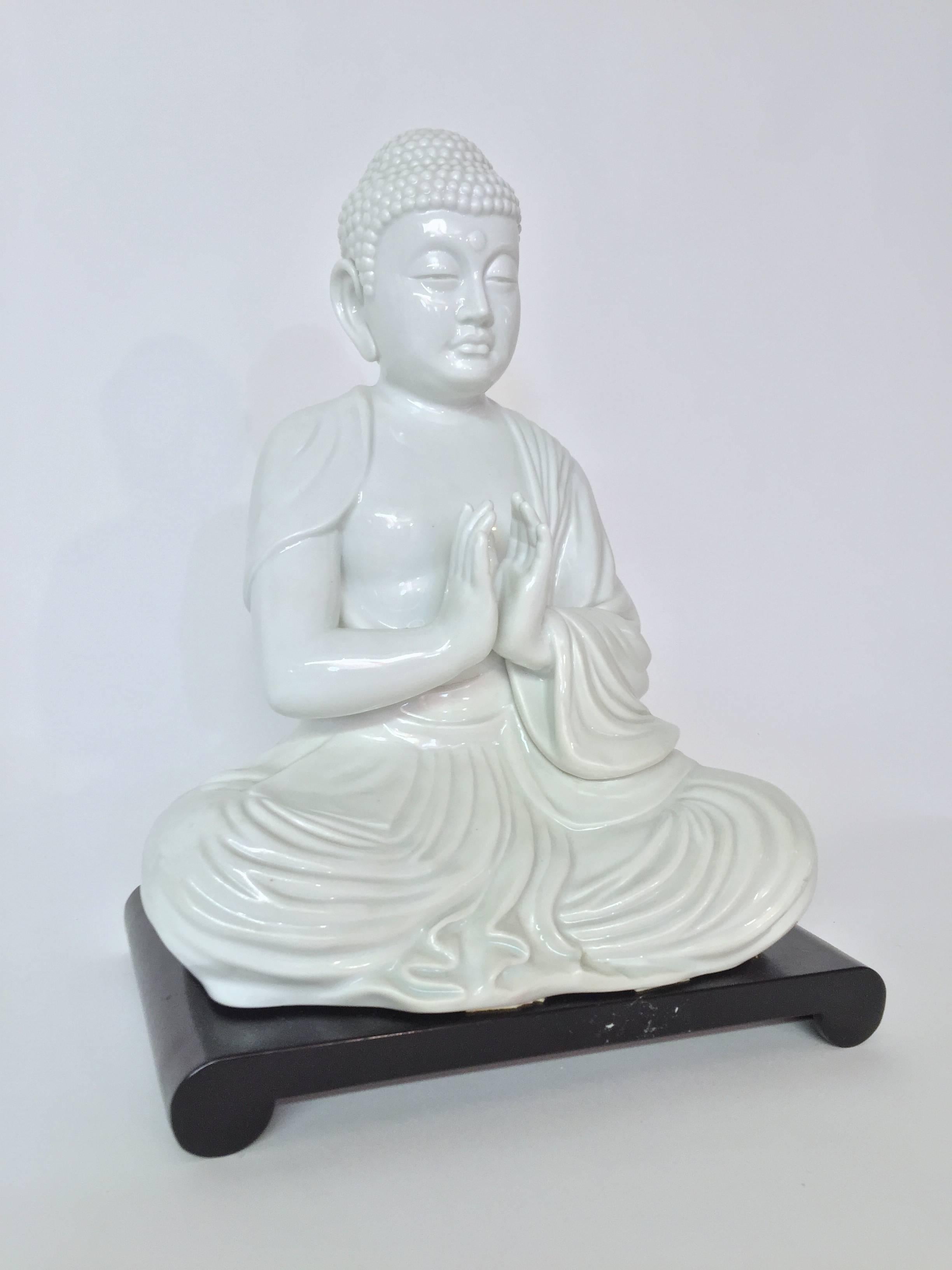 Serene and peaceful porcelain seated Buddha figure for Fitz and Floyd. Seated on a plastic platform. Signed on the underside, FF, Japan.