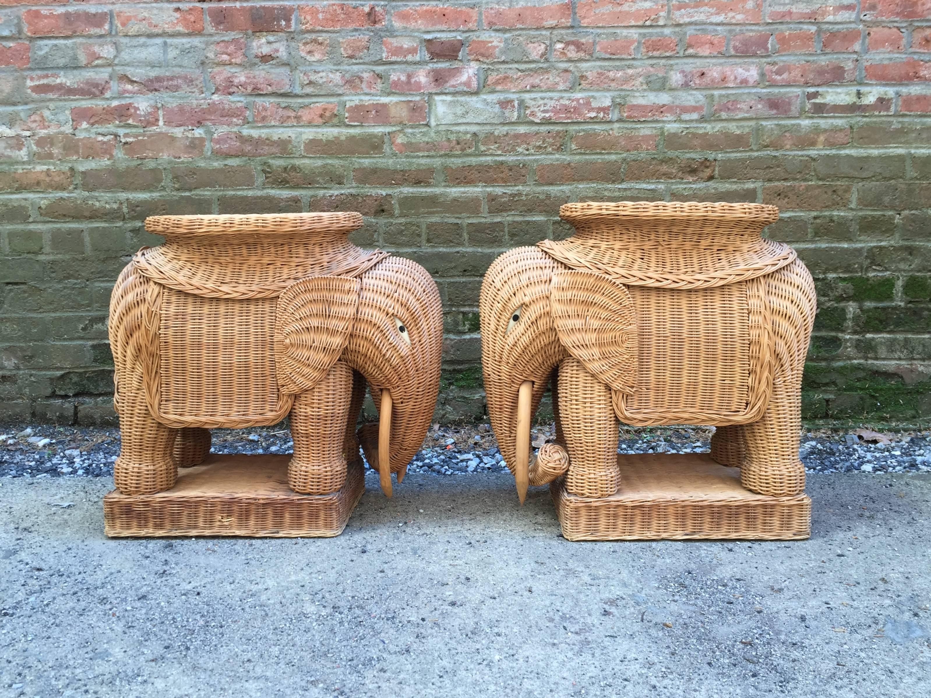 Wonderful pair of woven wicker and bamboo garden stool elephants. Painted eyes, solid bamboo tusks with woven wicker bodies, circa 1970-1980.