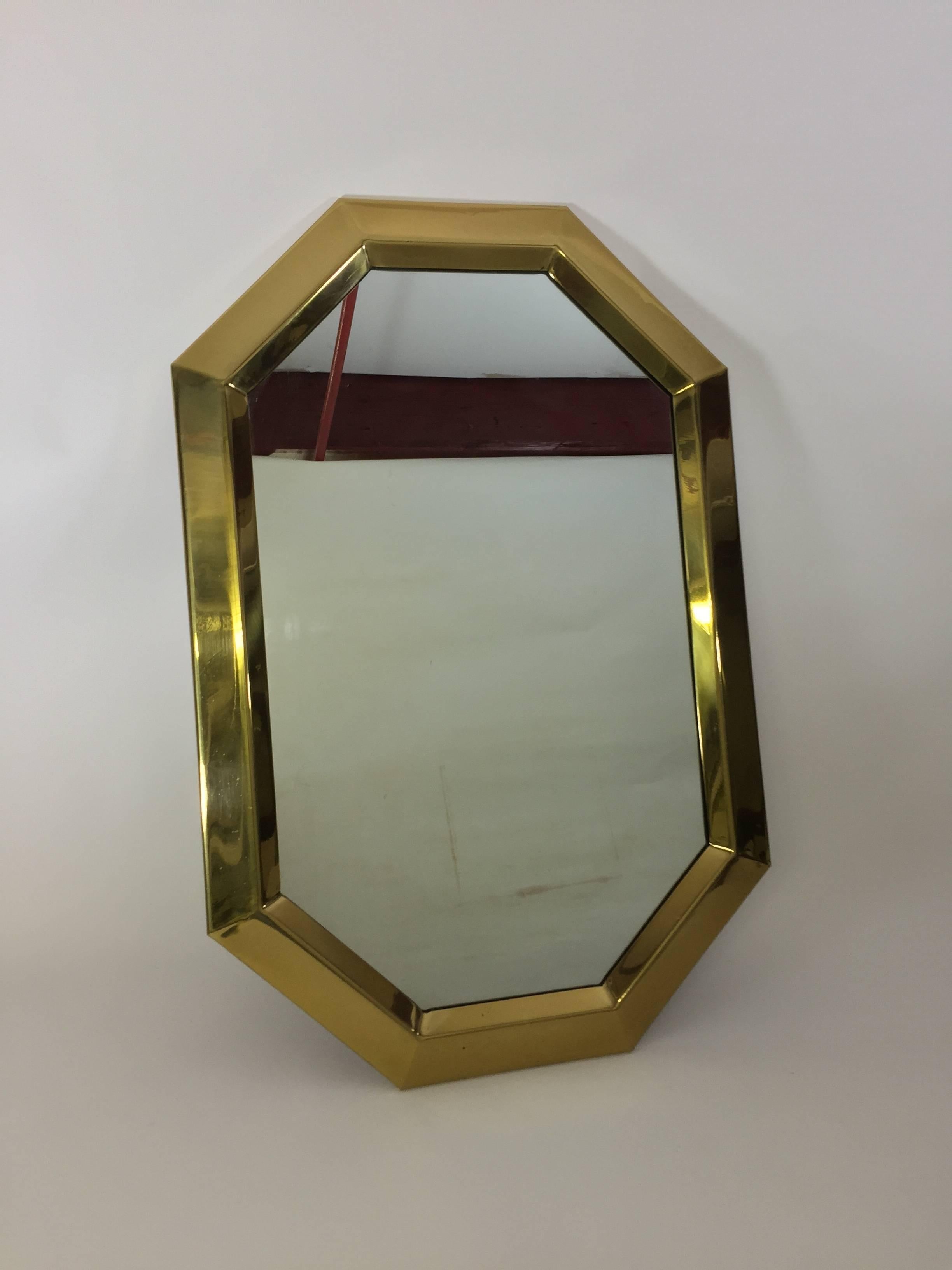 Beveled brass 1970s mirror. Very good condition. Can be hung vertically or horizontally.